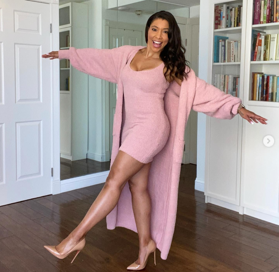 Jeanette Jenkins smiles while posing in a pink dress and matching cardigan | Source: Instagram/msjeanettejenkins