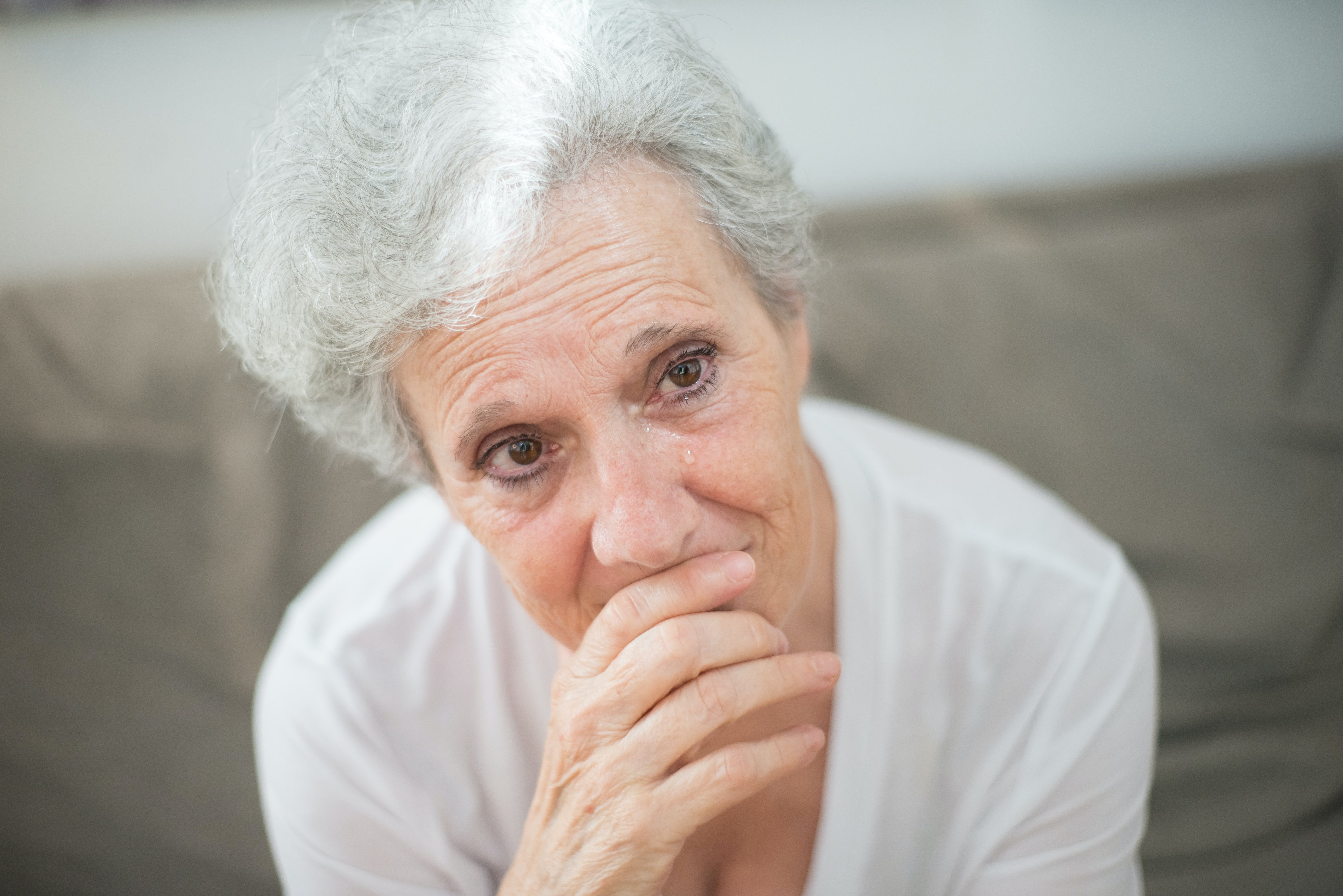 A teary-eyed senior lady | Source: Pexels