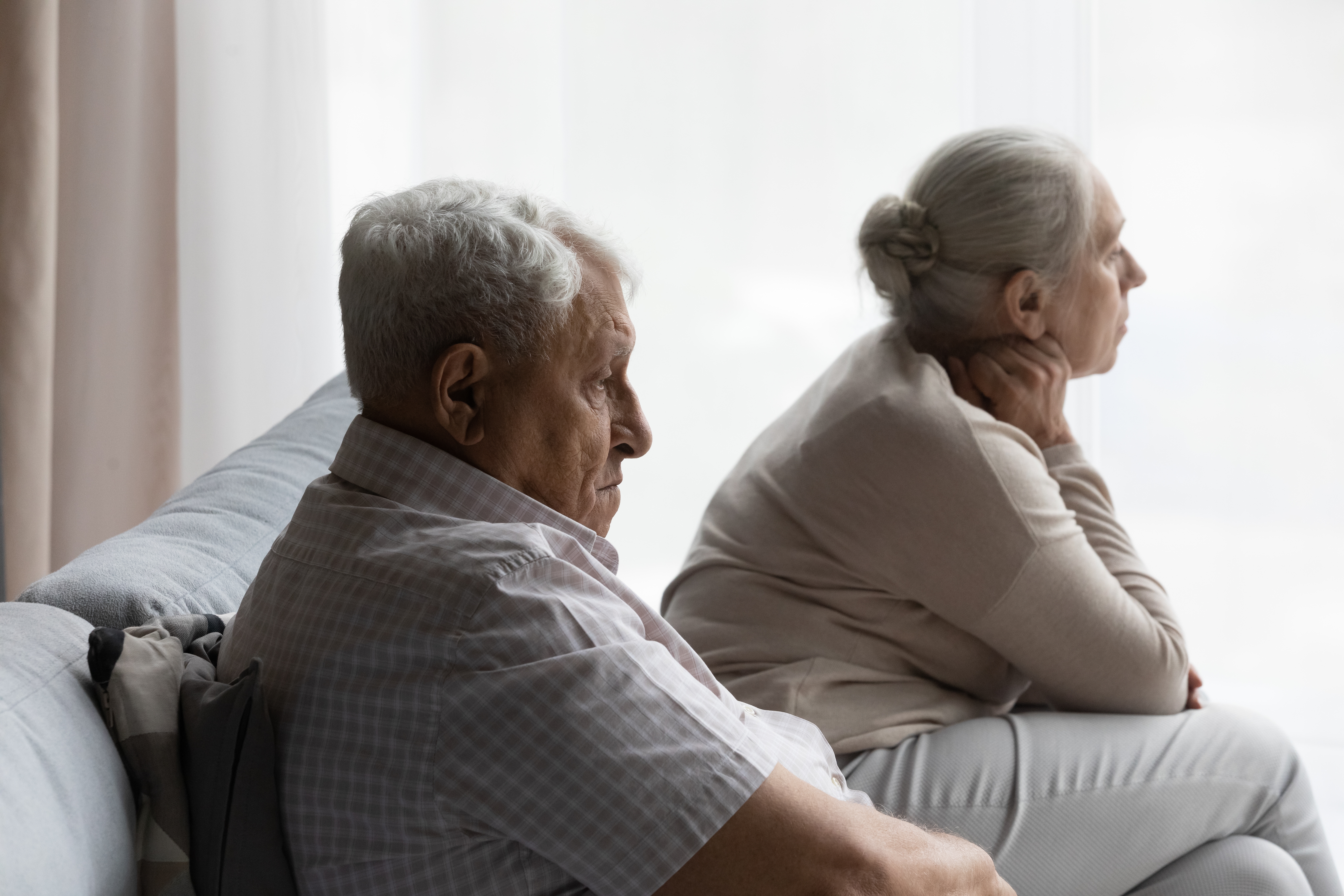 A serious-looking older couple | Source: Shutterstock