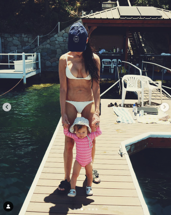 Demi Moore poses in a white two-piece bikini with her granddaughter Louetta to celebrate her daughter Scout LaRue Willis's 33rd birthday, posted in July 2024 | Source: Instagram/rumerwillis