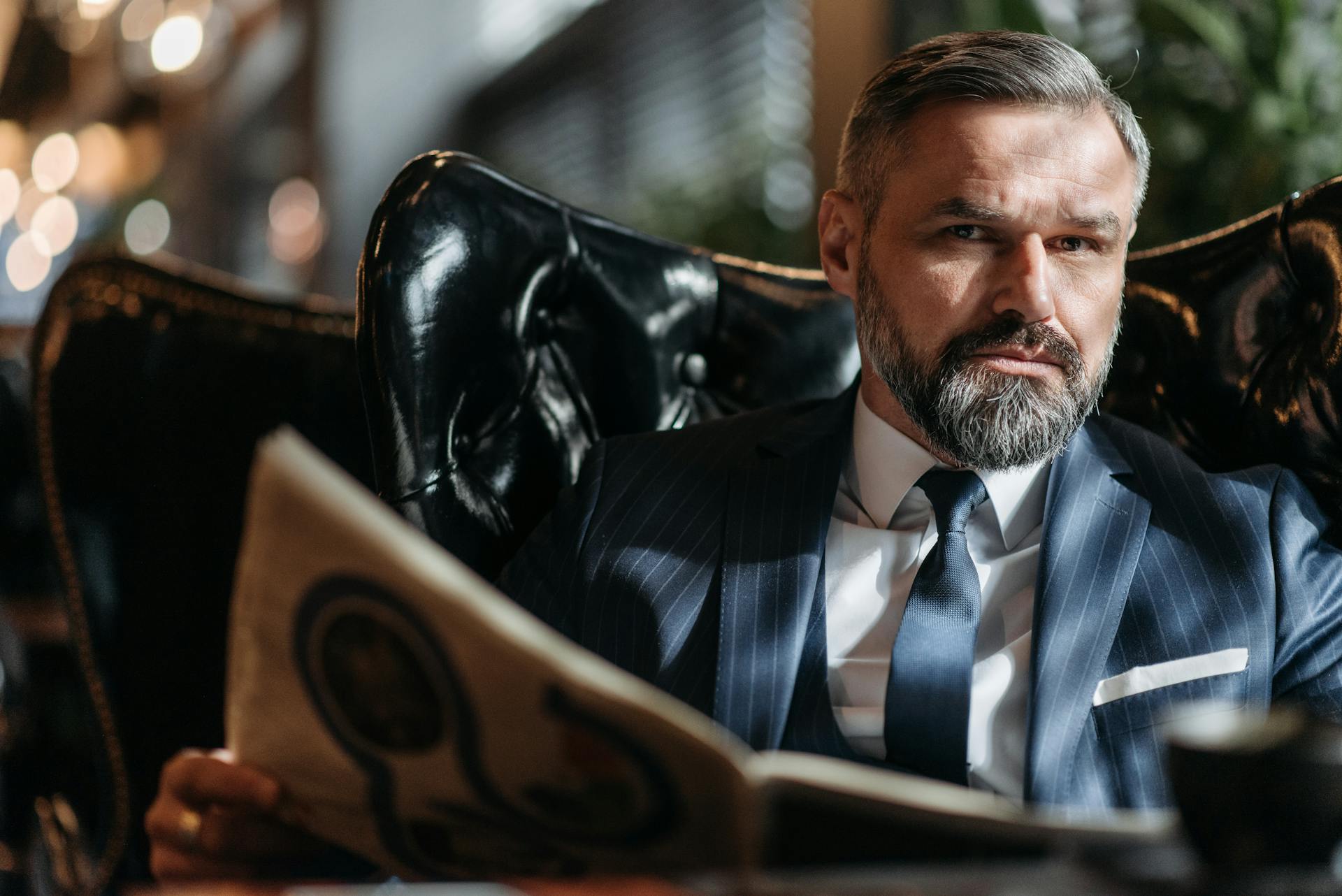 A businessman sitting in his office | Source: Pexels
