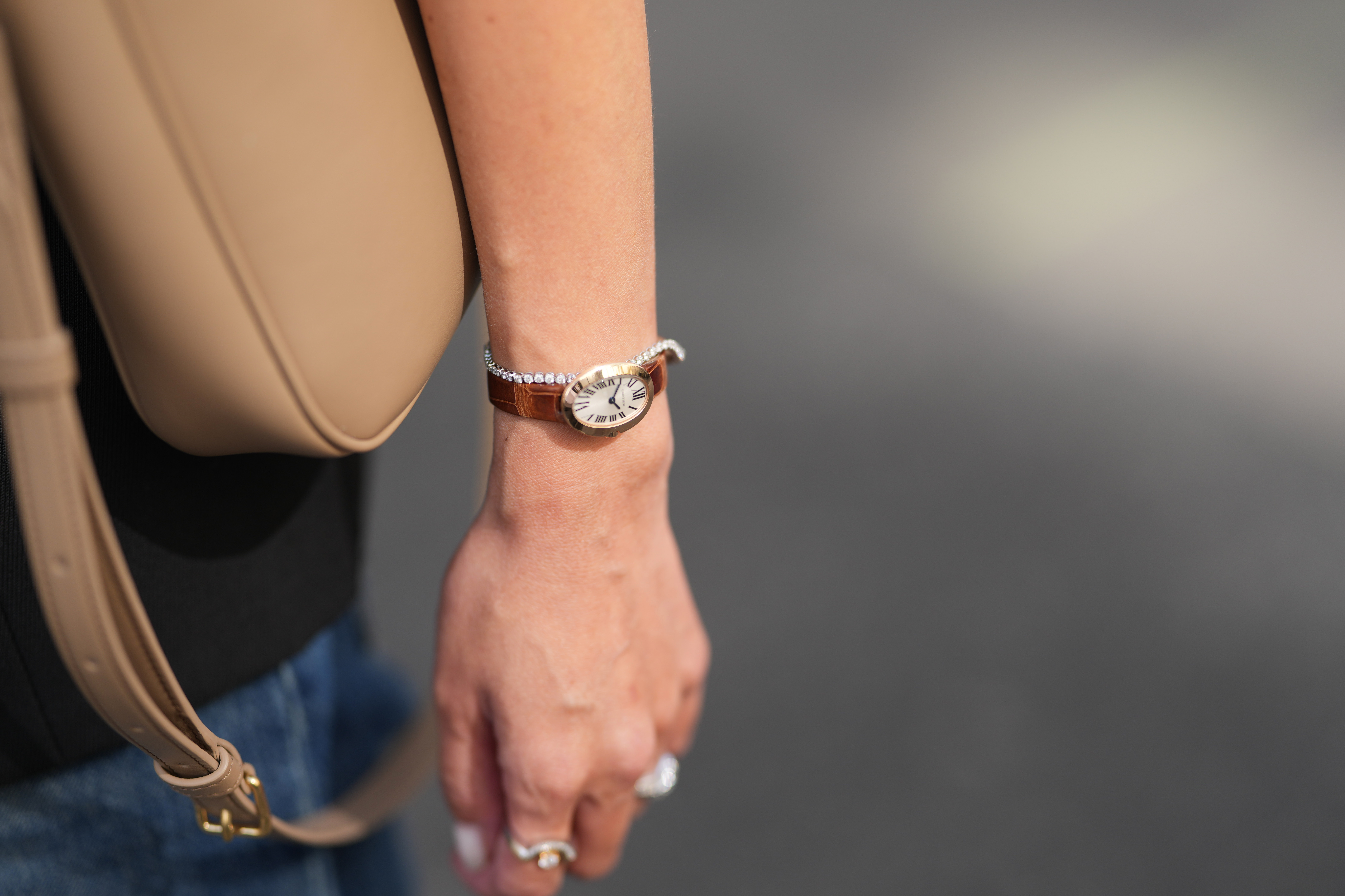 Close-up of a Cartier Baignoire watch, over a diamond bracelet, during a street style photo shoot, on September 7, 2026 in Paris, France | Source: Getty Images
