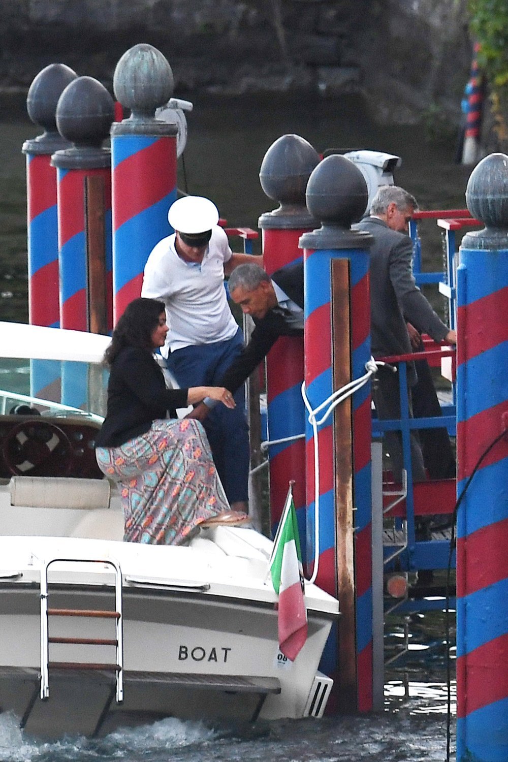 Barack Obama disembarking a boat at Lake Como | Photo: Hollywood Life