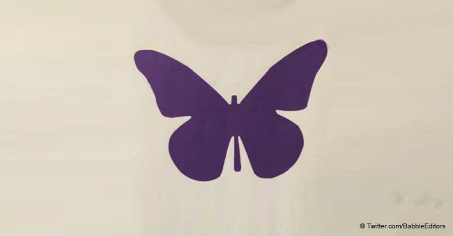 Das bedeutet ein violetter Schmetterling auf der Krippe eines Babys in der Neugeborenenstation