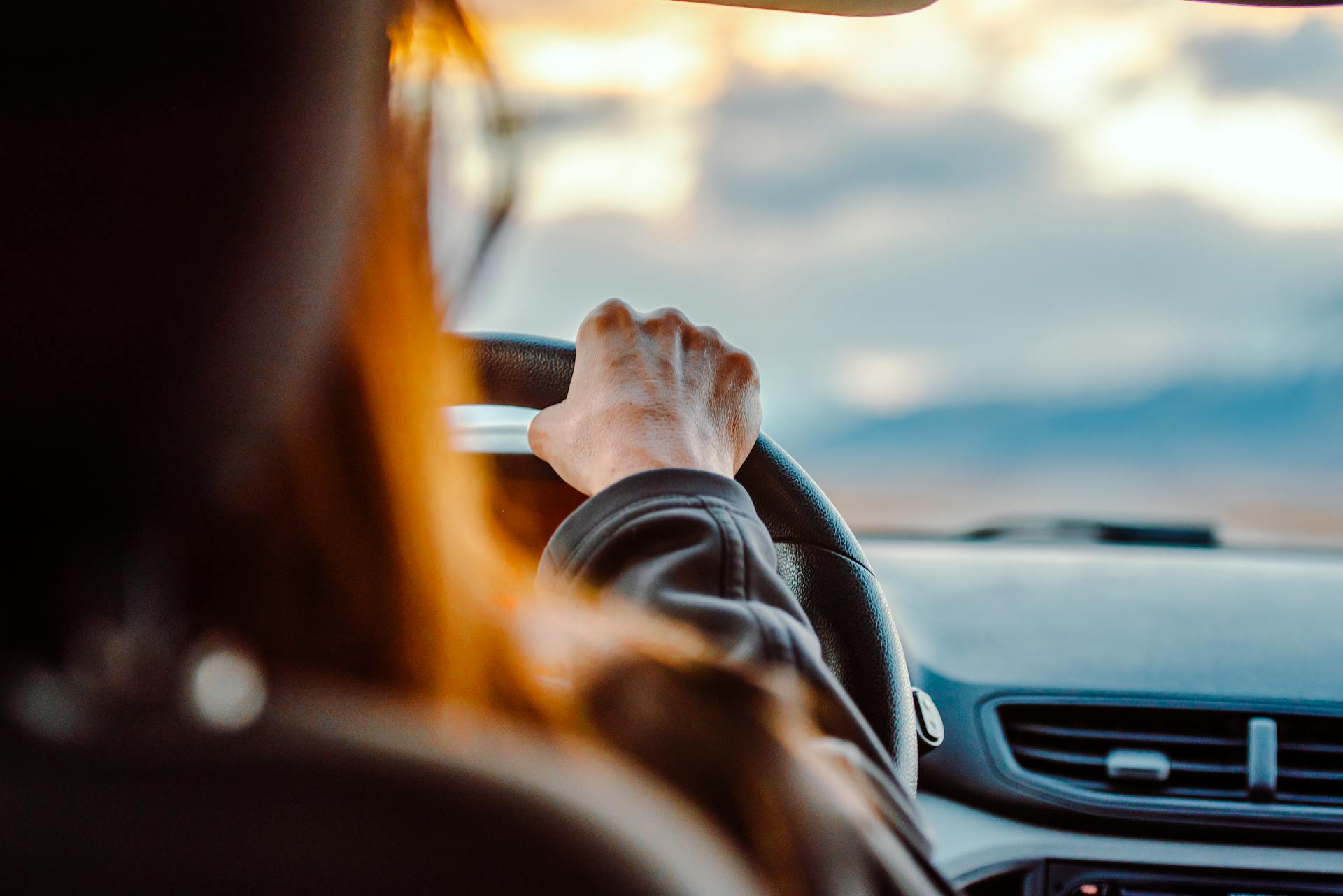 A woman driving a car | Source: Pexels