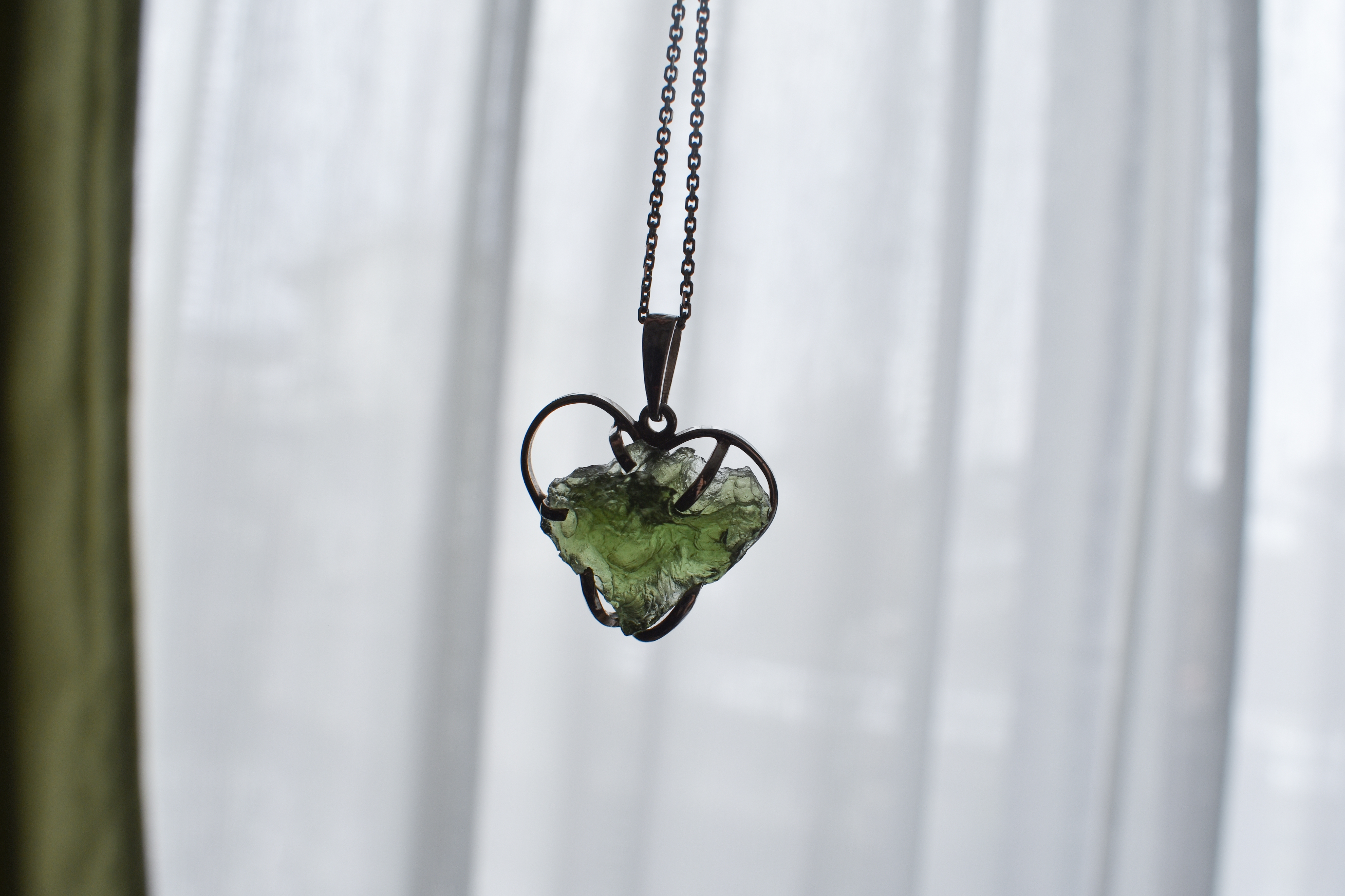 Photo of moldavite used as the pendant of jewelry | Source: Shutterstock