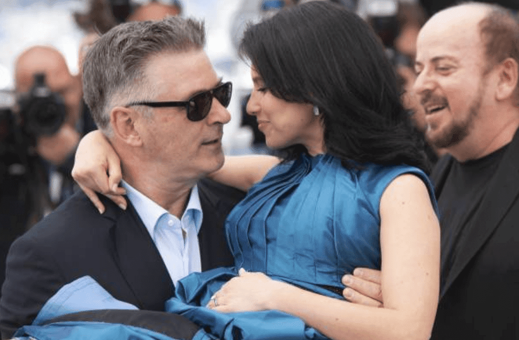  Alec Baldwin carries his wife, Hilaria Baldwin in his arms as they attend the photocall for "Seduced and Abandoned" at the 66th Annual Cannes Film Festival, on May 21, 2013 in Cannes, France | Source: Laurent KOFFEL/Gamma-Rapho via Getty Images
