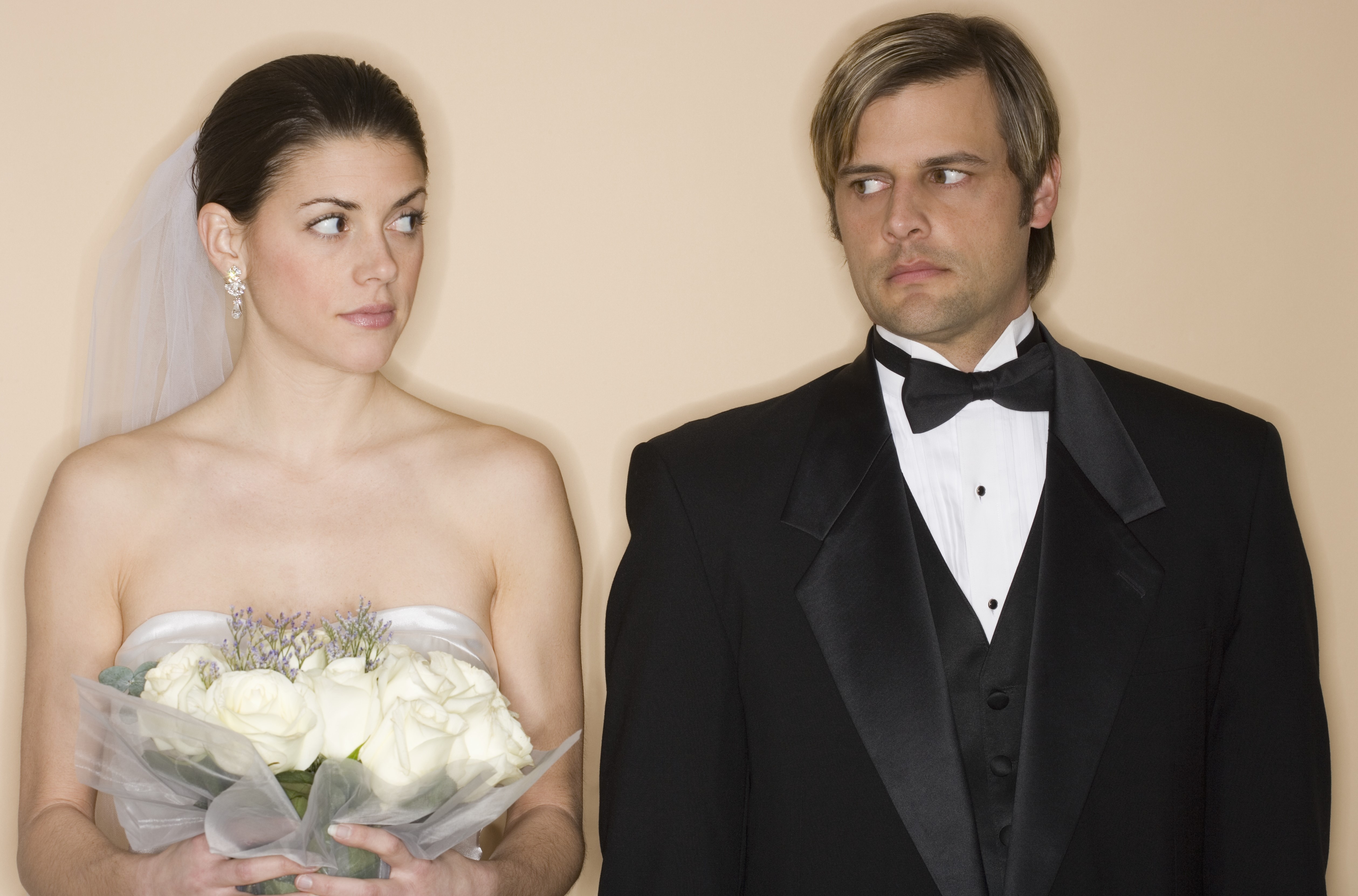 Angry groom with his bride | Source: Getty Images