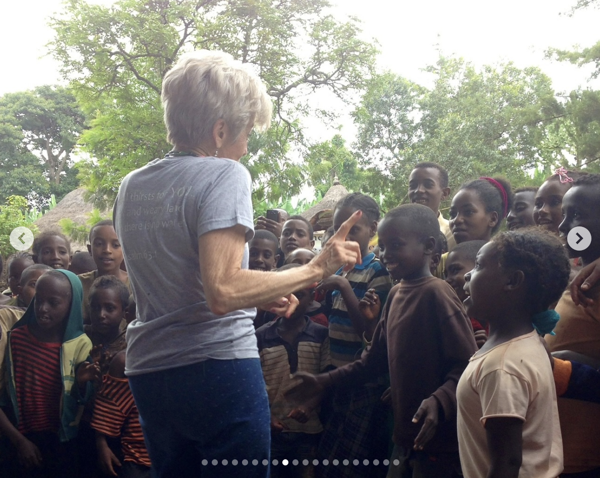 Jane Etta Pitt is pictured talking to Ethiopian children, dated August 6, 2025 | Source: Instagram/pidney