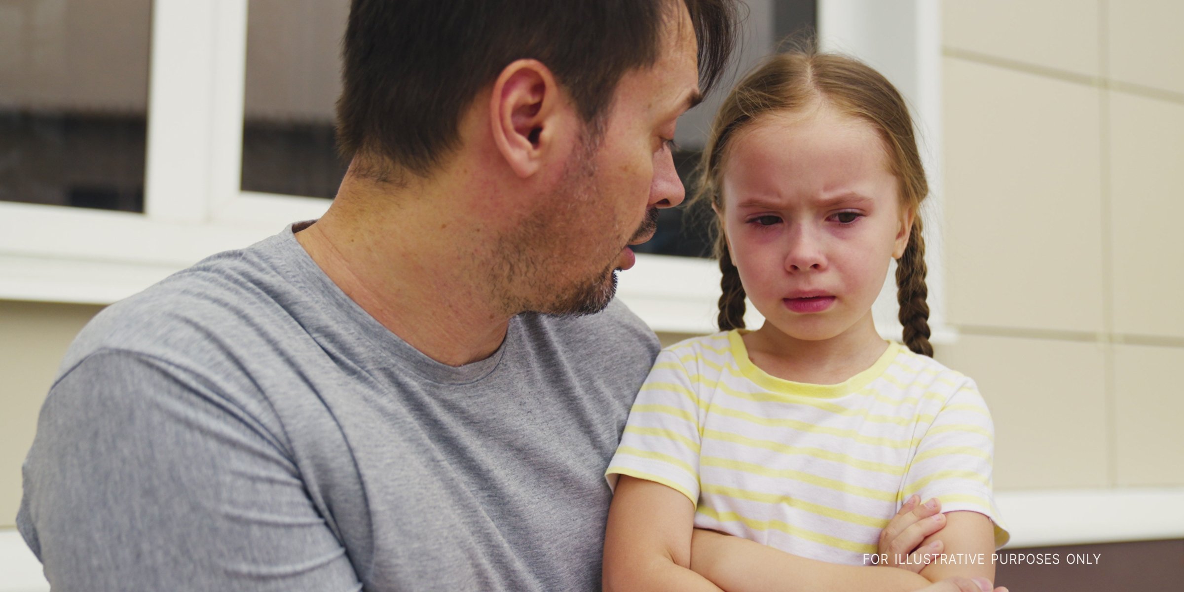 Upset Girl Talking to Her Dad. | Source: Shutterstock