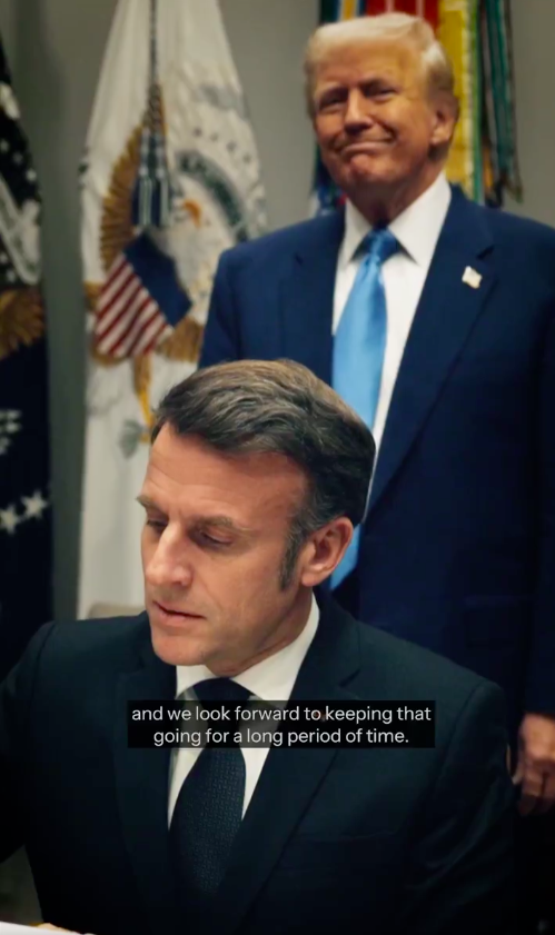 Emmanuel Macron signing something as Donald Trump smiles and looks on. | Source: X/@POTUS