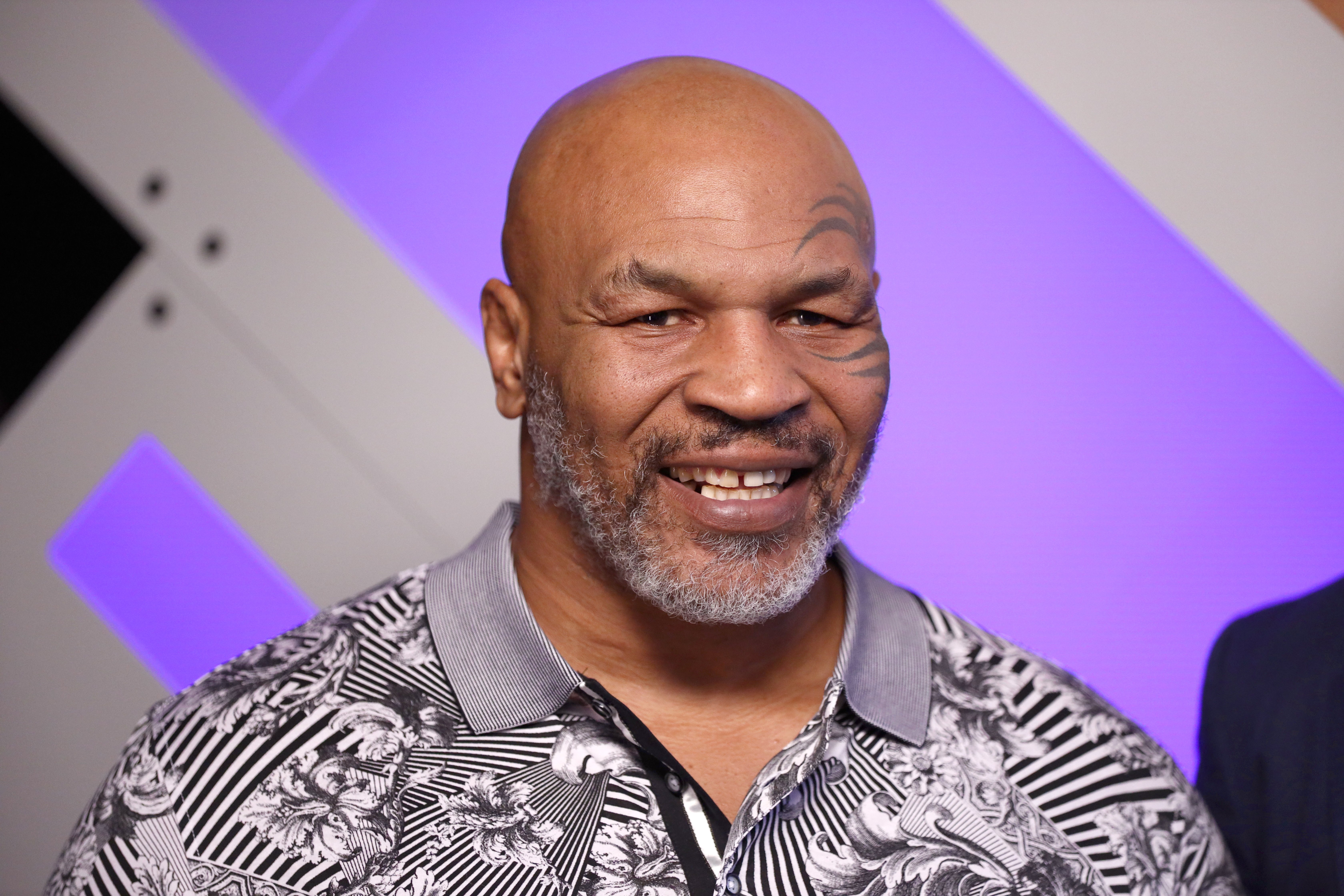 Mike Tyson speaks with Mario Lopez at Capital One Podcast Studio during the 2019 iHeartRadio Podcast Awards Presented by Capital One at the iHeartRadio Theater LA on January 18, 2019, in Burbank, California. | Source: Getty Images.