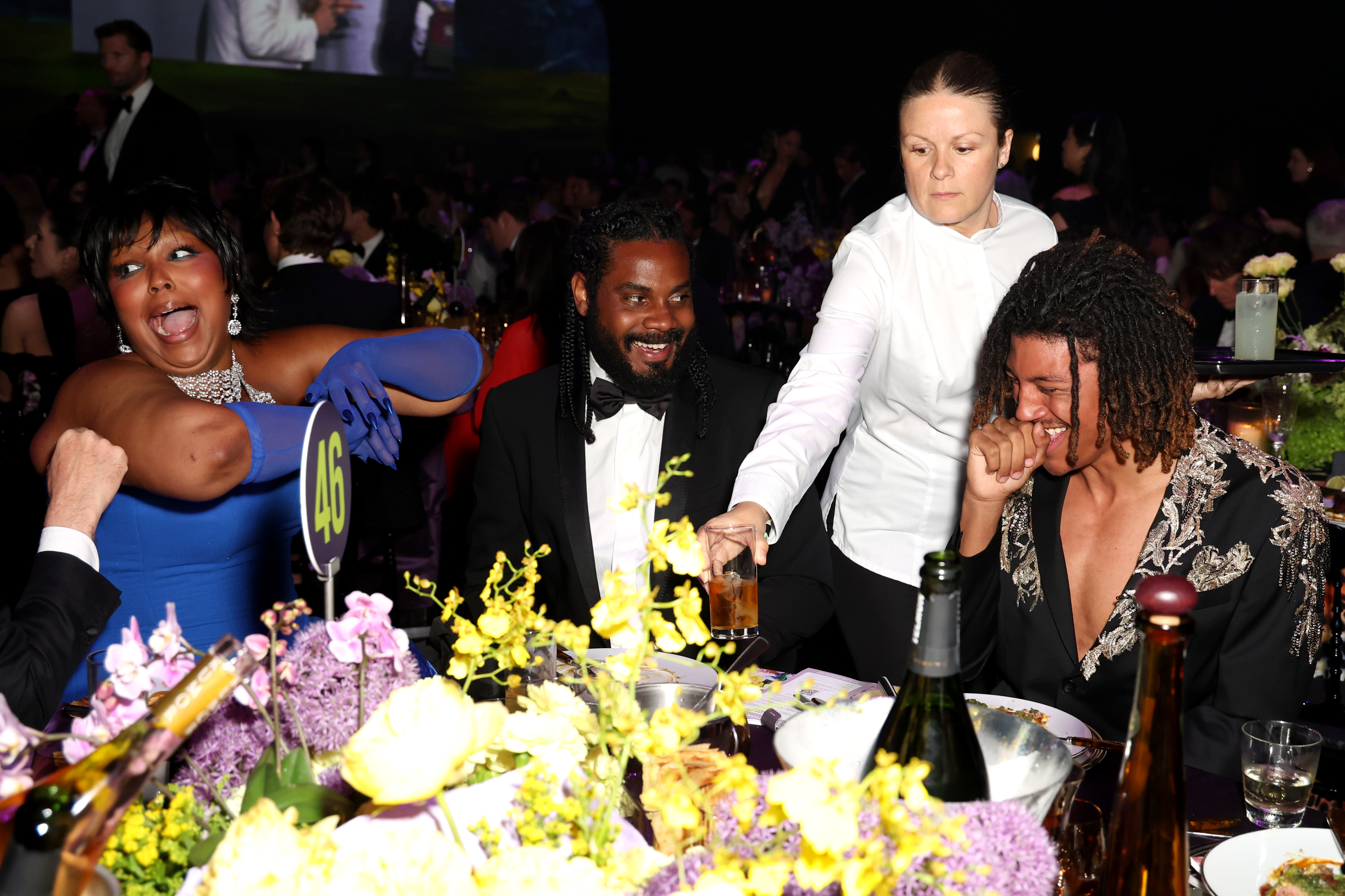 Lizzo, Myke Wright and Henry Samuel react during the amfAR Gala Cannes presented by Chopard at Hotel du Cap-Eden-Roc on May 21, 2026, in Cap d'Antibes, France | Source: Getty Images