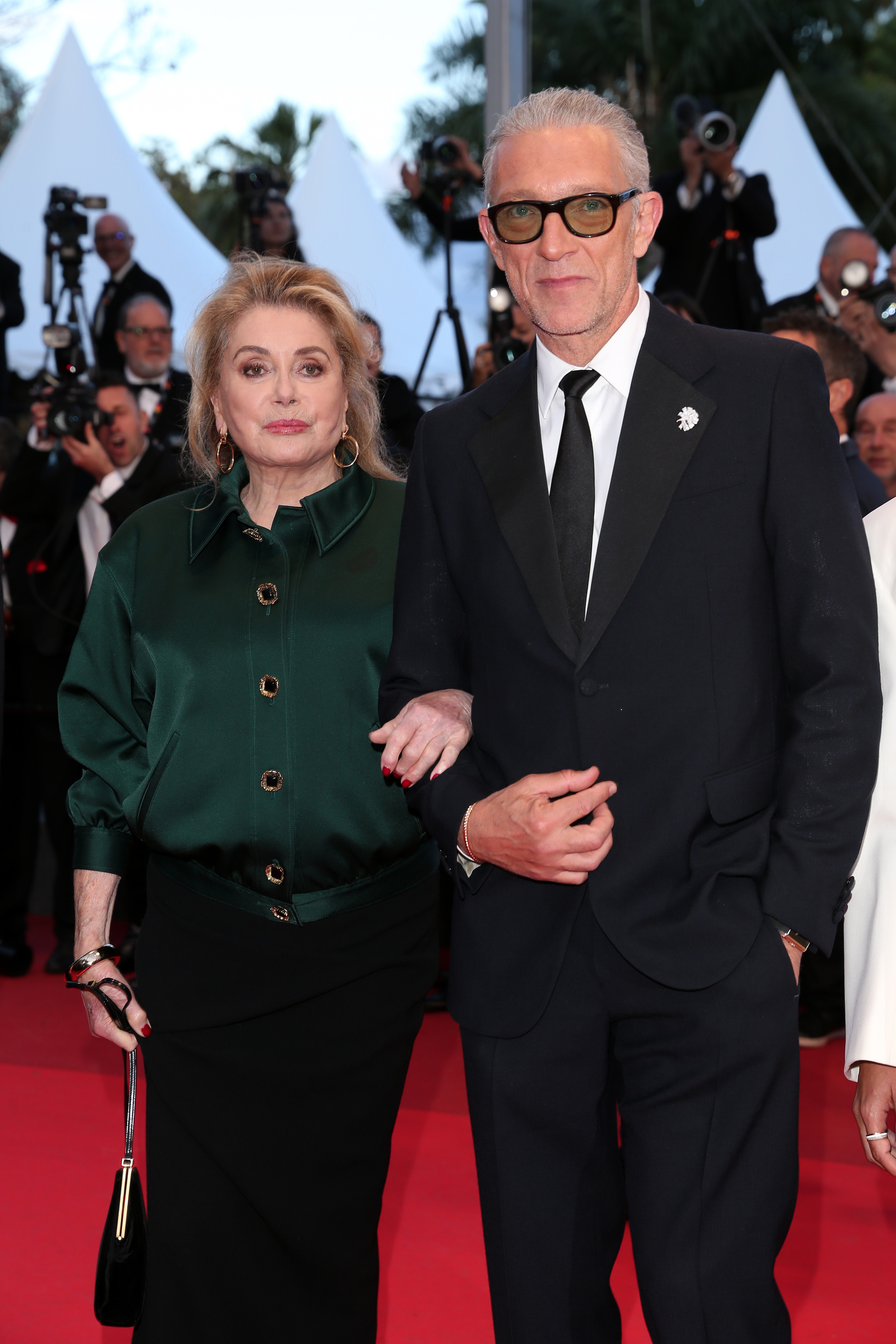 The actress (L), with Vincent Cassel, attends the "Histoires Parallèles (Parallel Tales)" screening during the 79th annual Cannes Film Festival at Palais des Festivals on May 14, 2026 in Cannes, France. | Source: Getty Images