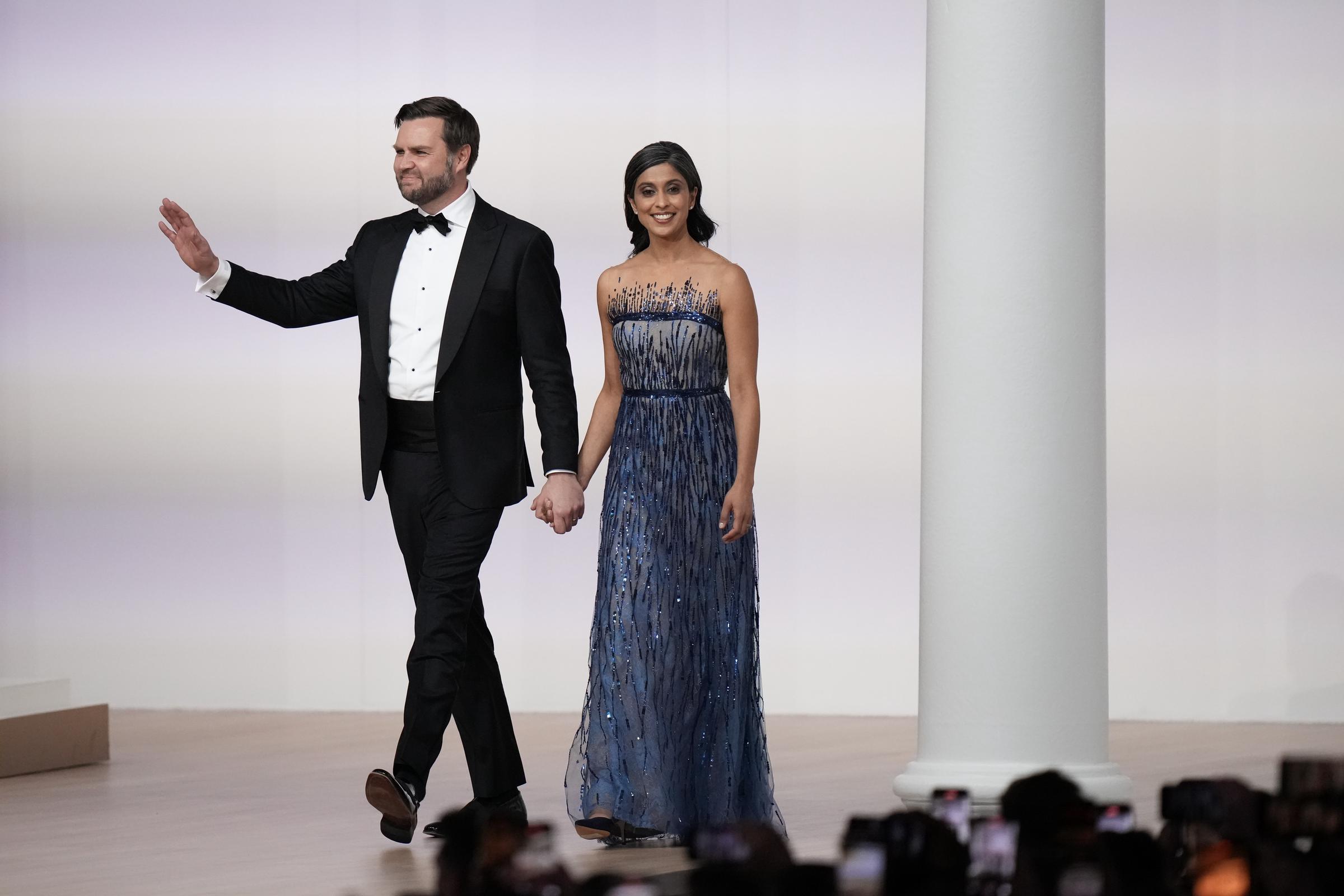 Vice President J.D. Vance waves at the crowd while walking with Second Lady Usha at the Commander-in-Chief Ball | Source: Getty Images