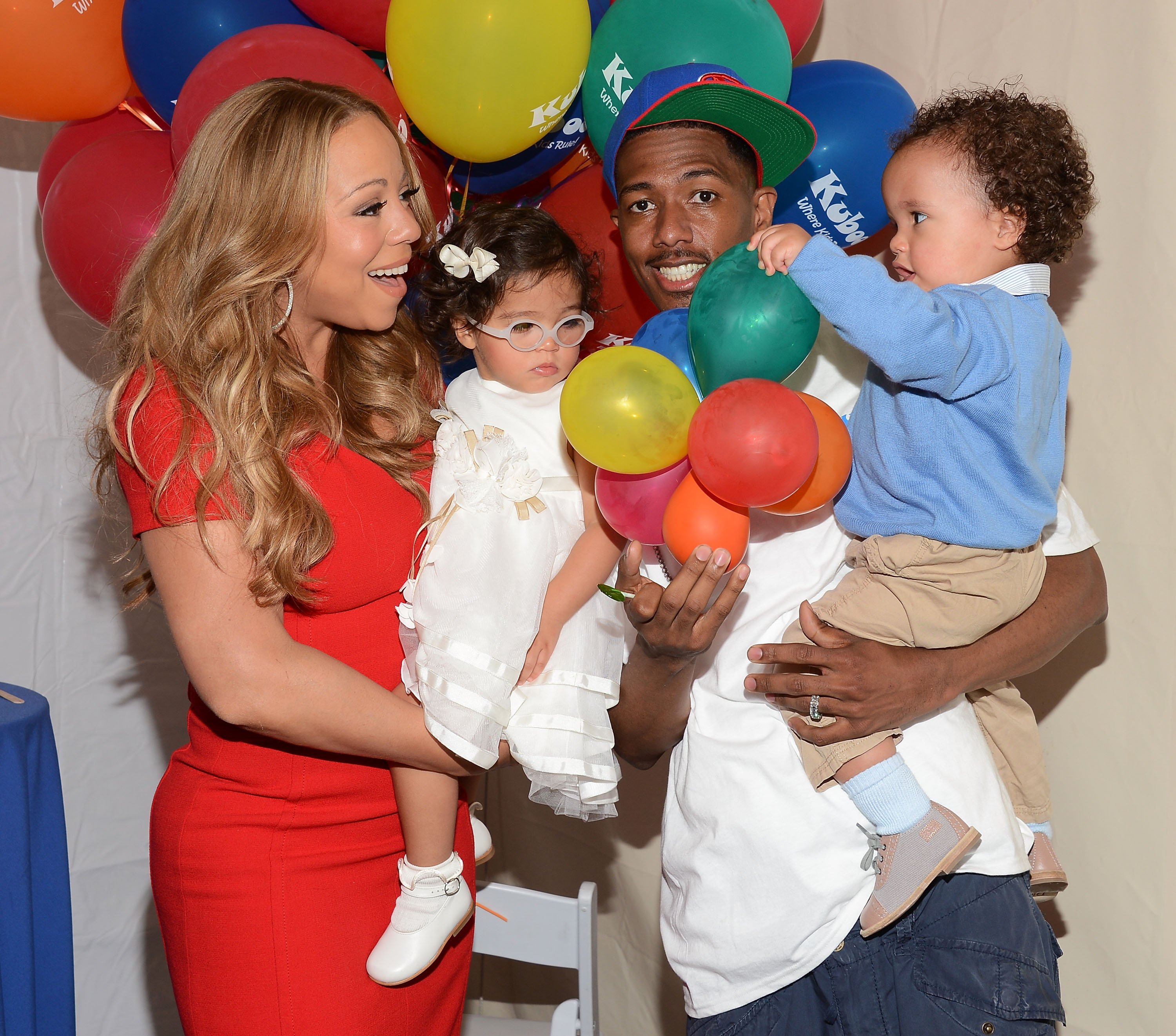 Recording artist Mariah Carey, Nick Cannon and their children Monroe Cannon (L) and Moroccan Cannon attend "Family Day" hosted by Nick Cannon at Santa Monica Pier on October 6, 2012 | Source: Getty Images 