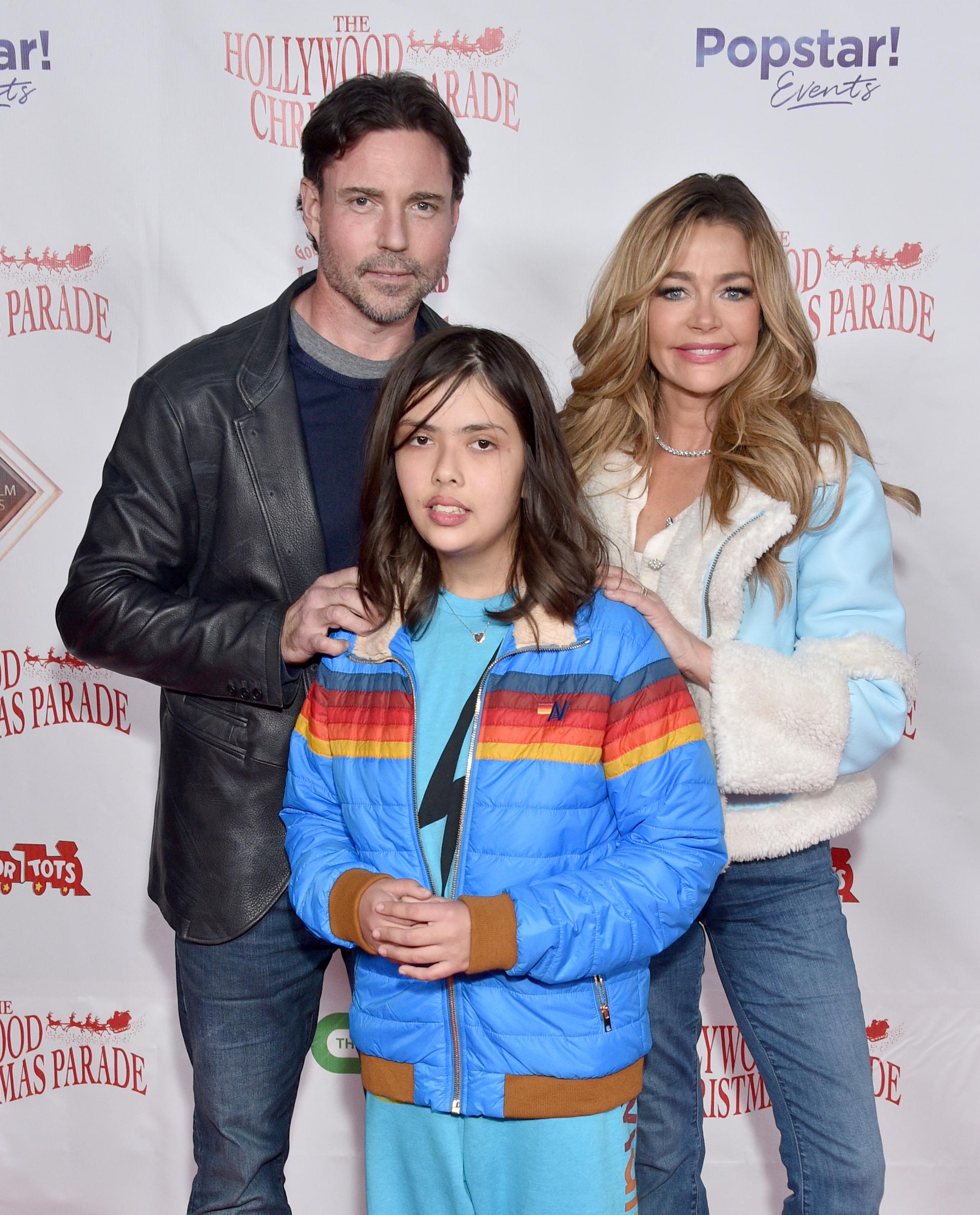 Aaron Phypers, Denise Richards, and their adopted daughter Eloise attend the 91st Hollywood Christmas Parade in Los Angeles on November 26, 2023 | Source: Getty Images