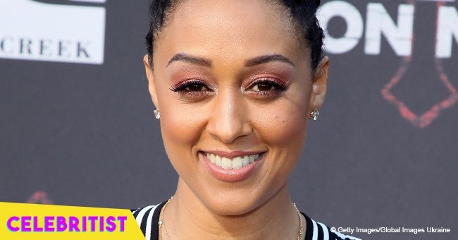 Tia Mowry showcases slimmer curves in tight leggings and T-shirt in new photo