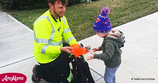 A sick 2-year-old boy receives a bag full of gifts from trashman