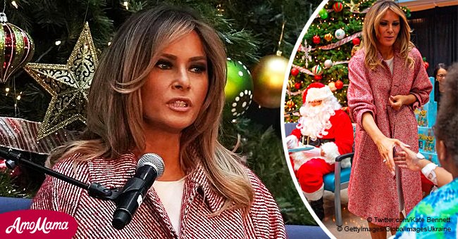 Melania dons $1,200 oversized coat with red and white stripes to bring Christmas to sick kids