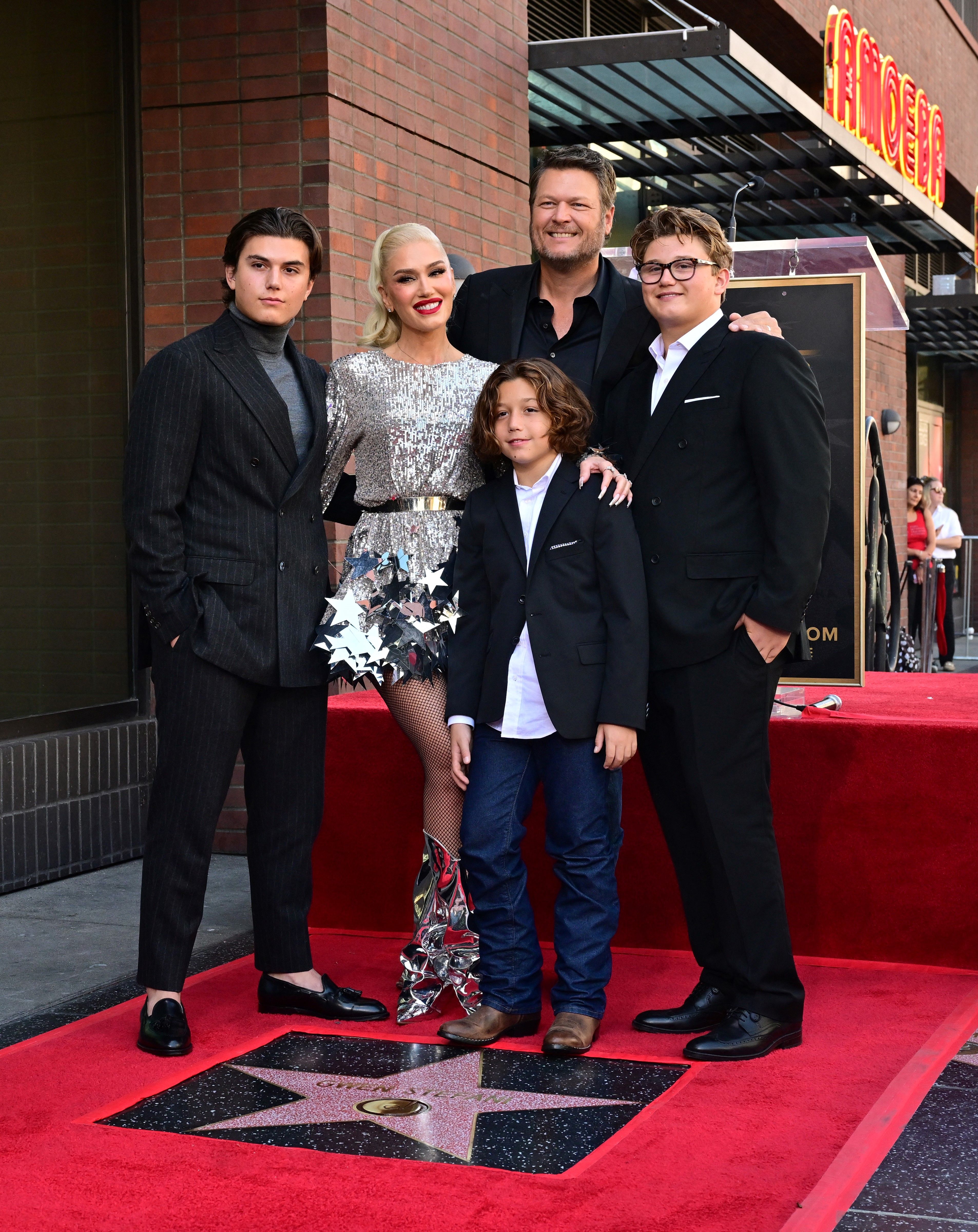 Gwen Stefani with her husband, Blake Shelton, and her sons, Kingston, Zuma, and Apollo Rossdale, during her Hollywood Walk of Fame Star ceremony on October 19, 2023, in Hollywood, California. | Source: Getty Images