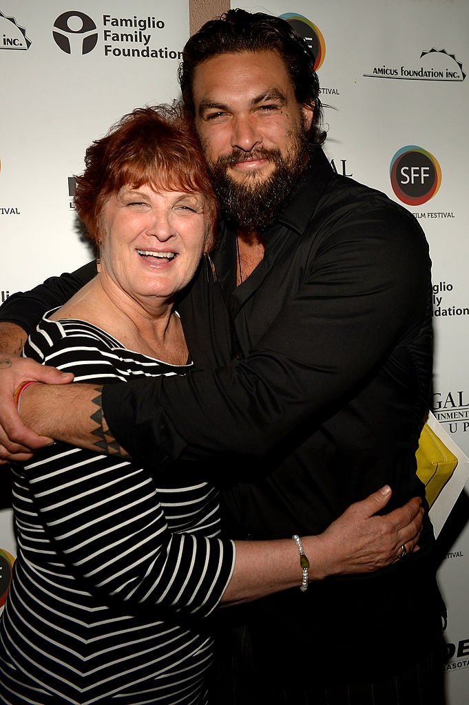 Jason Momoa (R) and his mother Coni Momoa arrive to a screening of 'Road to Paloma' during the Sarasota Film Festival | Getty Images