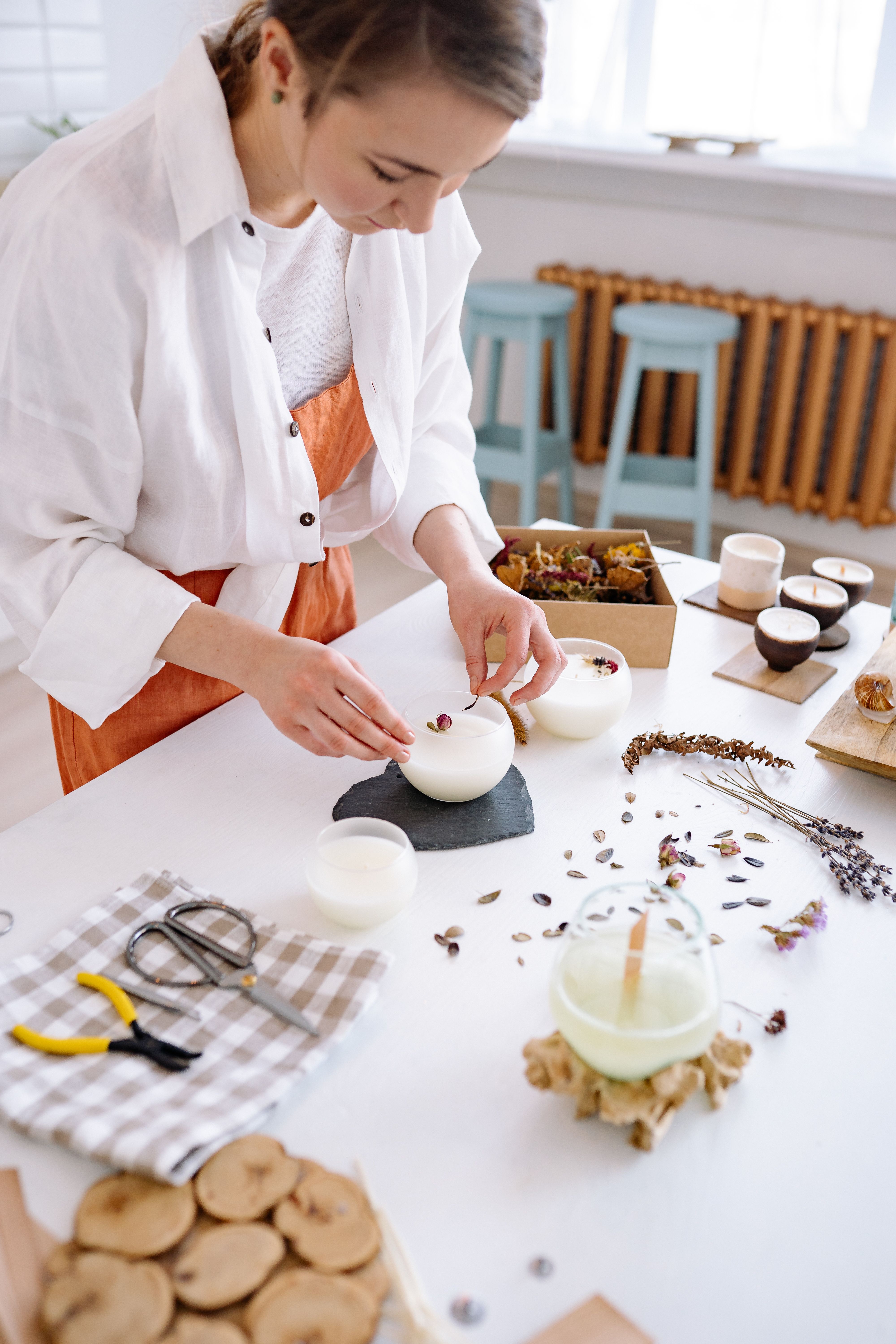 Woman crafting candles | Source: Pexels
