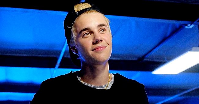 Justin Bieber at the Grand Opening of West Coast Customs Burbank Headquarters on December 7, 2014, in Burbank, California | Photo: Jerod Harris/Getty Images