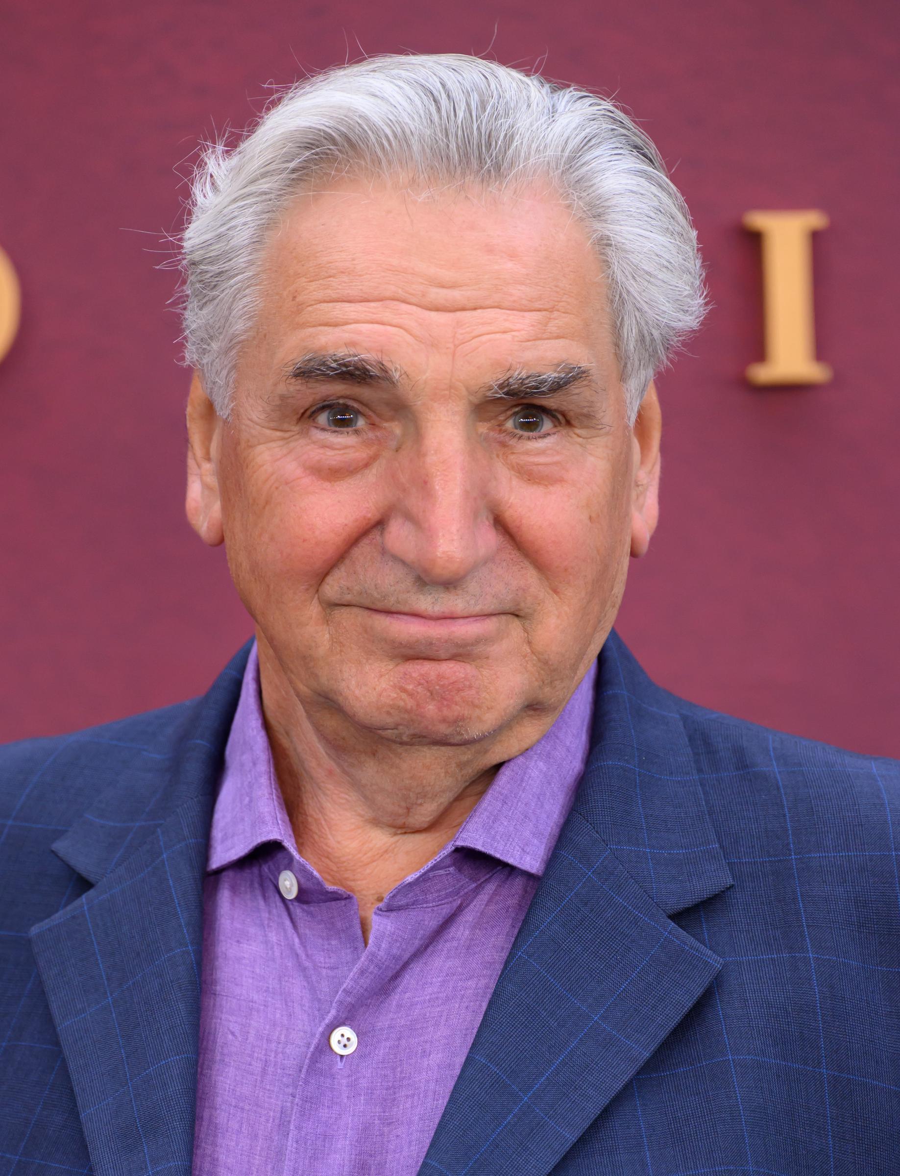 At the 2025 world premiere of "Downton Abbey: The Grand Finale" in London, Carter looked sharp in a blue checked blazer and lavender shirt. His silver hair and warm expression highlighted a sense of ease and familiarity, a decade removed from the strict formality of his on-screen persona.