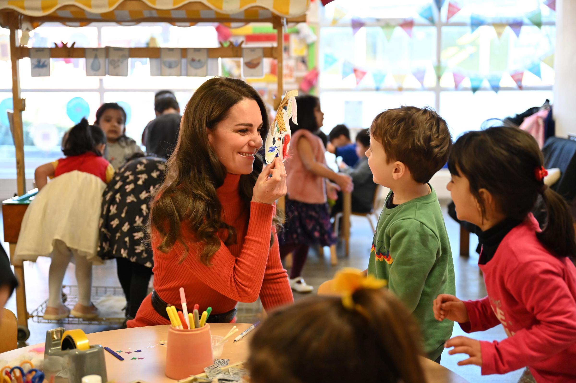 Catherine, Princess of Wales, interacts with children during her visit to Foxcubs Nursery on January 18, 2023, in Luton, England. | Source: Getty Images