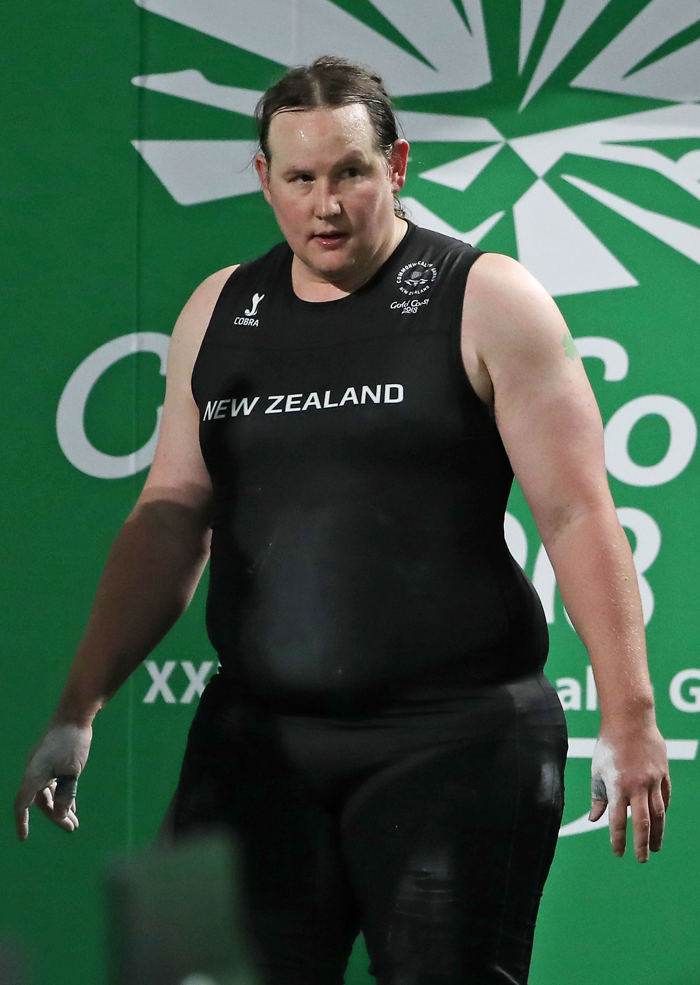 New Zealand athlete Laurel Hubbard walking on stage during the Women's +90kg Final during the Gold Coast 2018 Commonwealth Games at Carrara Sports and Leisure Centre on the Gold Coast, Australia | Photo: Scott Barbour/Getty Images
