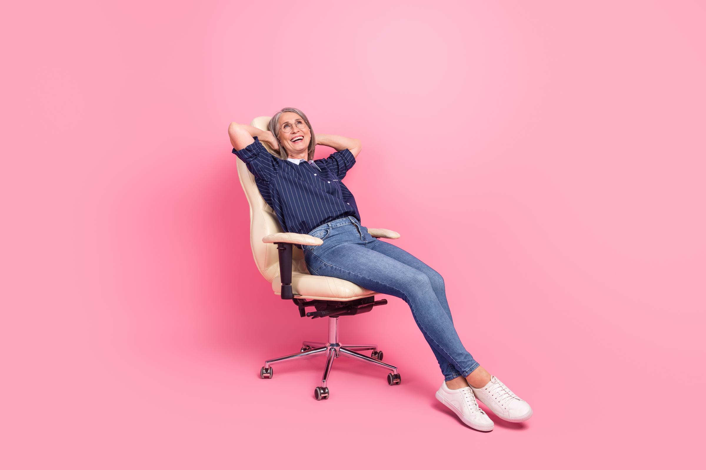 Woman lounging on a chair wearing sleek, comfortable shoes | Source: Shutterstock