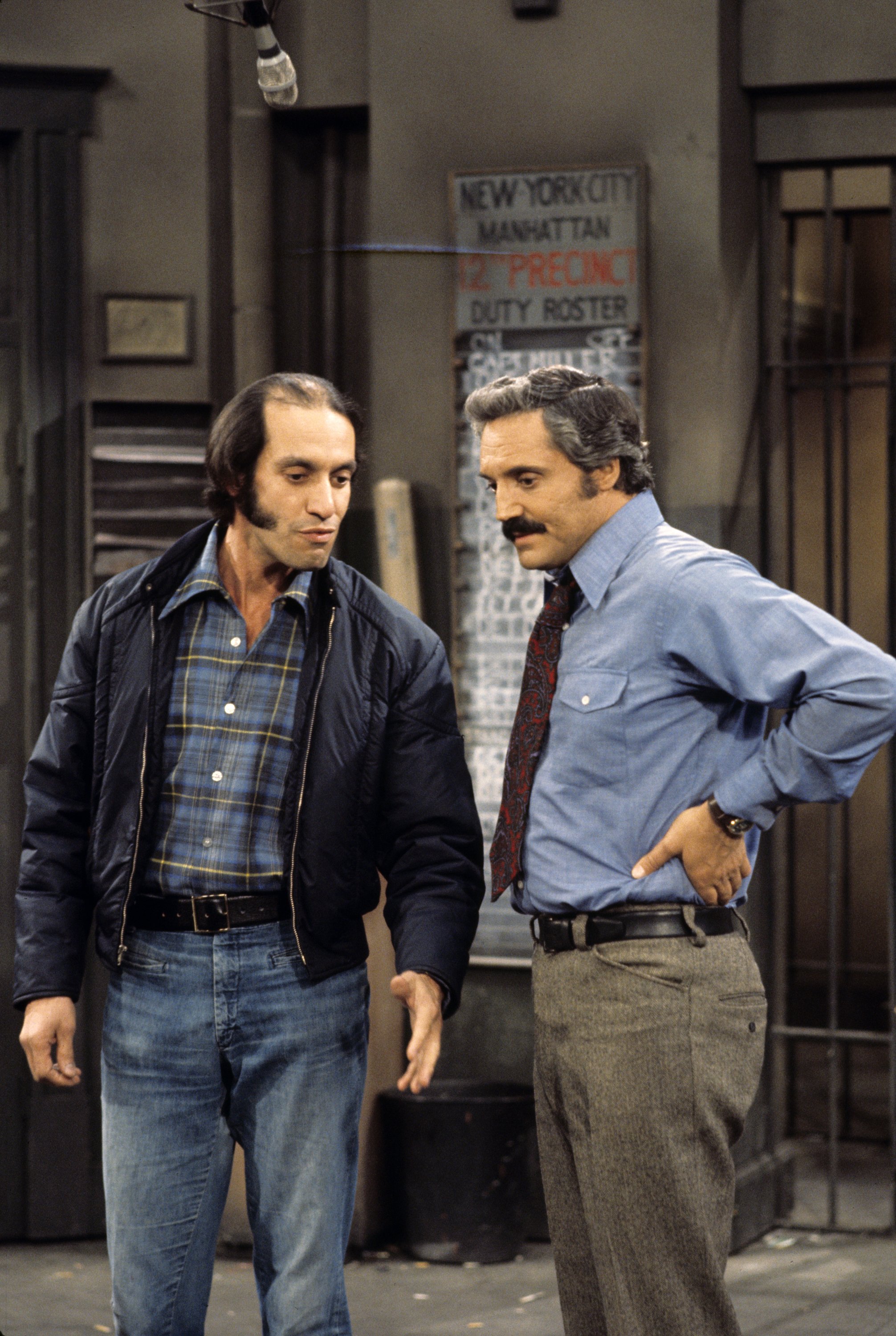Gregory Sierra (left) and Hal Linden (right) on the set of "Barney Miller" which premiered in 1975. | Photo: Getty Images.
