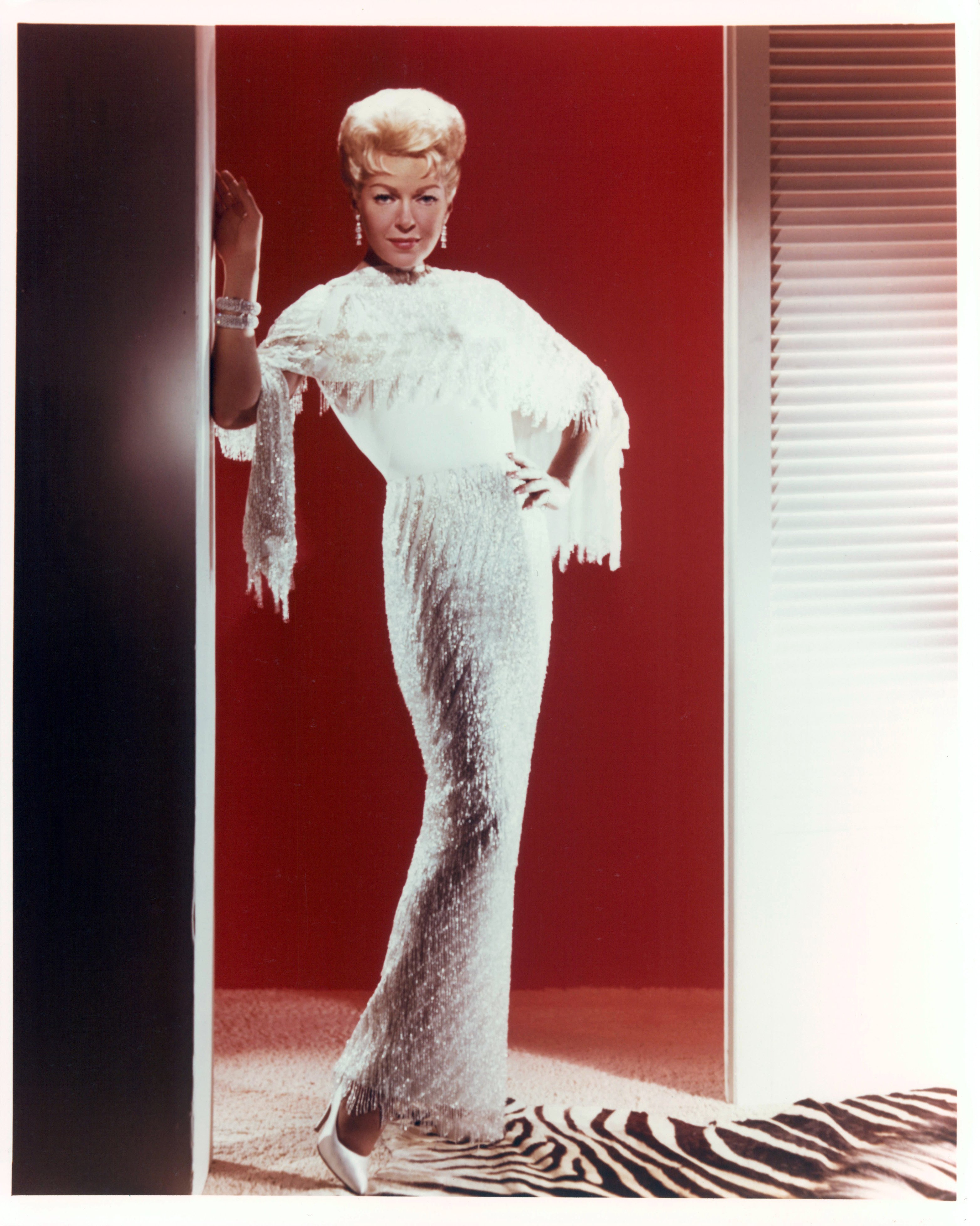 Lana Turner stands in a doorway in publicity portrait for the film 'Love Has Many Faces', 1965. | Source: Getty Images