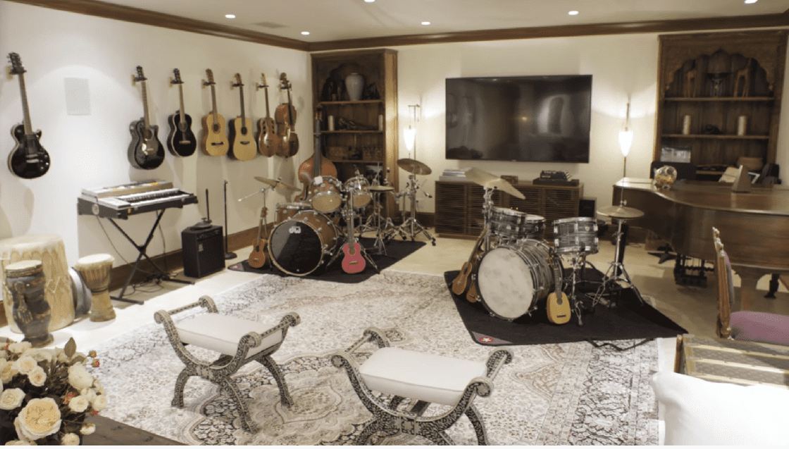 Pierce Brosnan and Keely Smith's music room filled with musical instruments. / Source: YouTube/@ArchitecturalDigestIndia