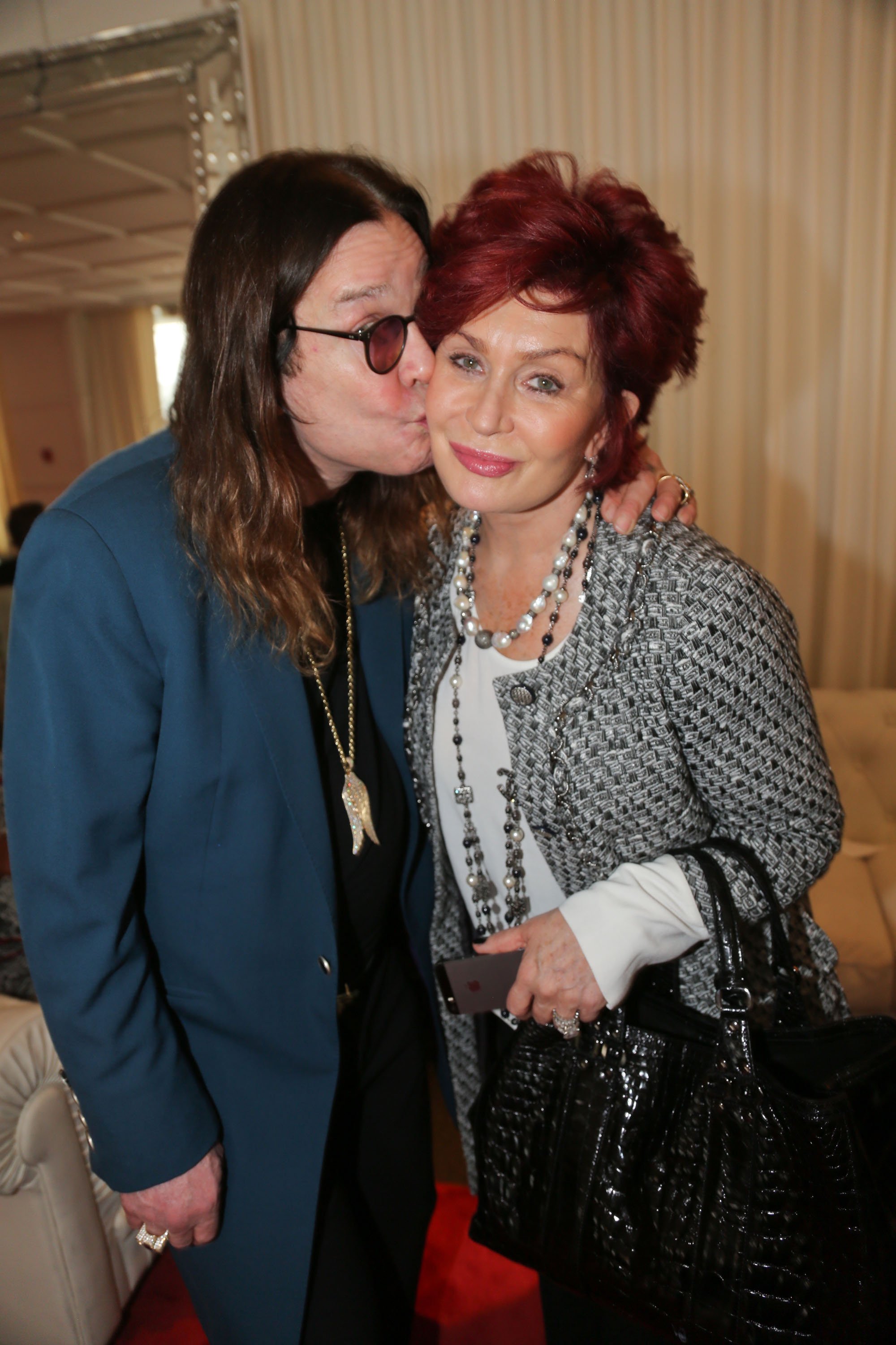 Ozzy Osbourne and his wife Sharon Osbourne attend ASCAP's 2014 Grammy Nominee Brunch at SLS Hotel on January 25, 2014, in Beverly Hills, California. | Source: Getty Images