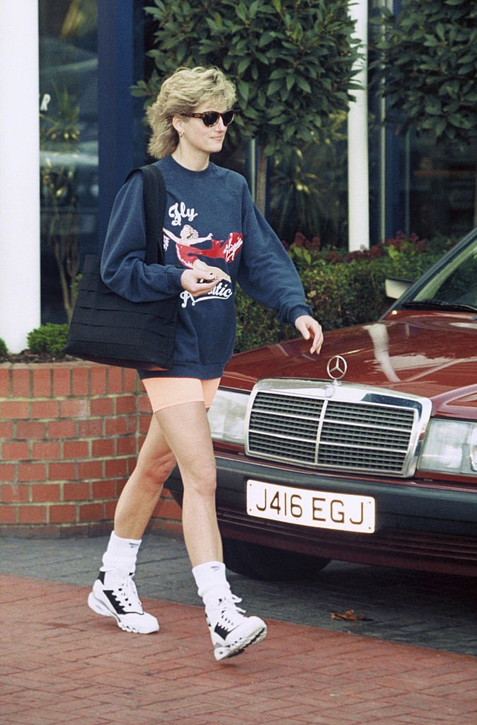 Princess Diana wearing chunky sneakers and shorts | Getty Images