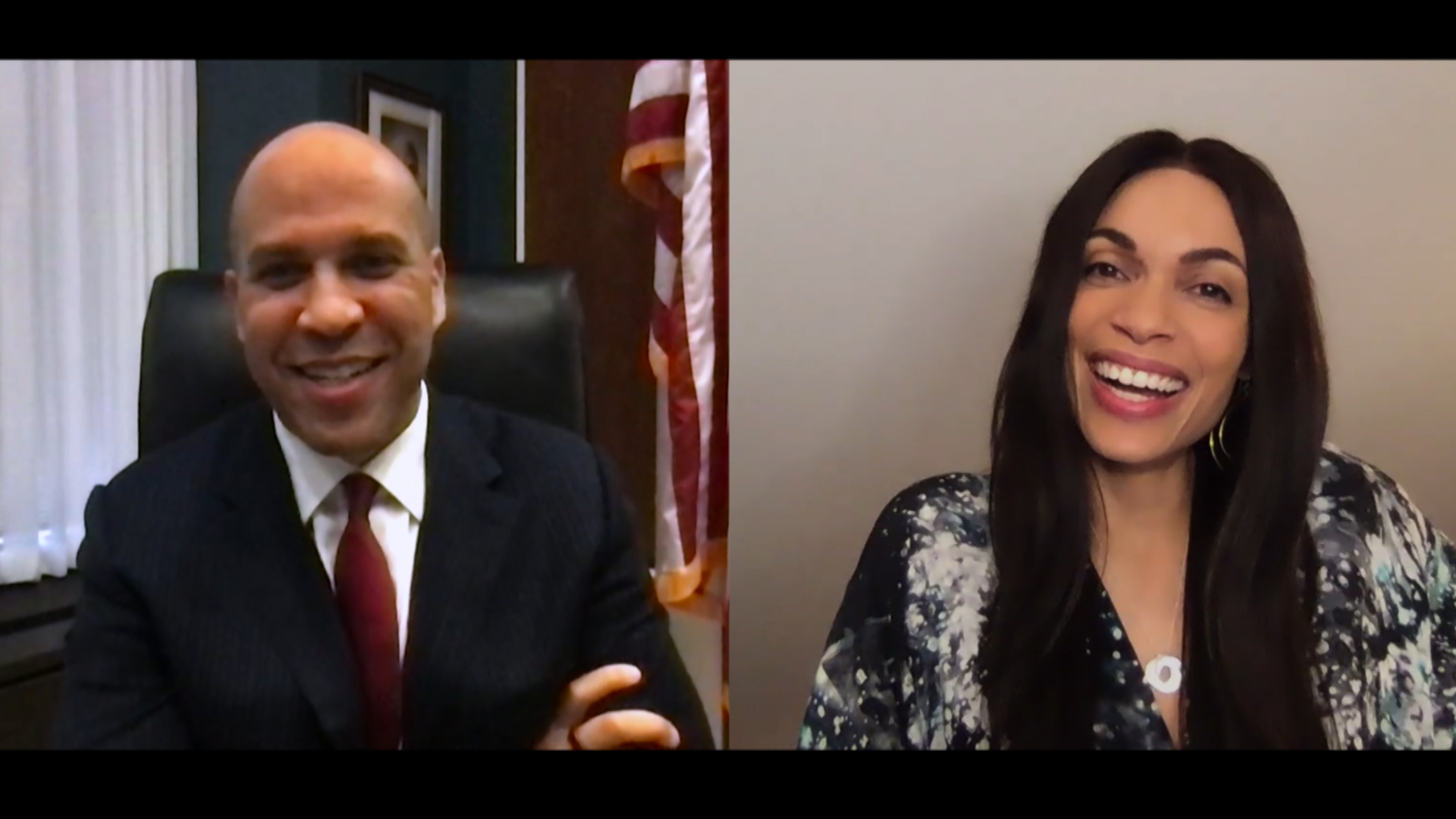 Cory Booker and Rosario Dawson light up the screen during a remote appearance on "The Tonight Show Starring Jimmy Fallon", their cheerful energy shining through even from separate screens.
