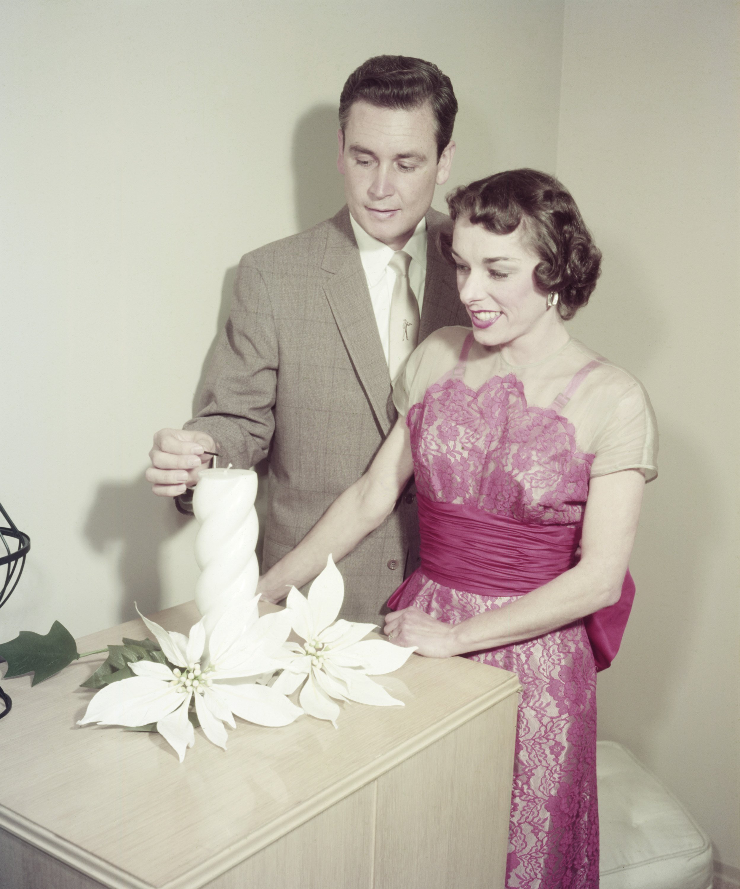 Bob Barker and his wife Dorothy Jo Barker look cute together while lighting a candle. | Source: Getty Images