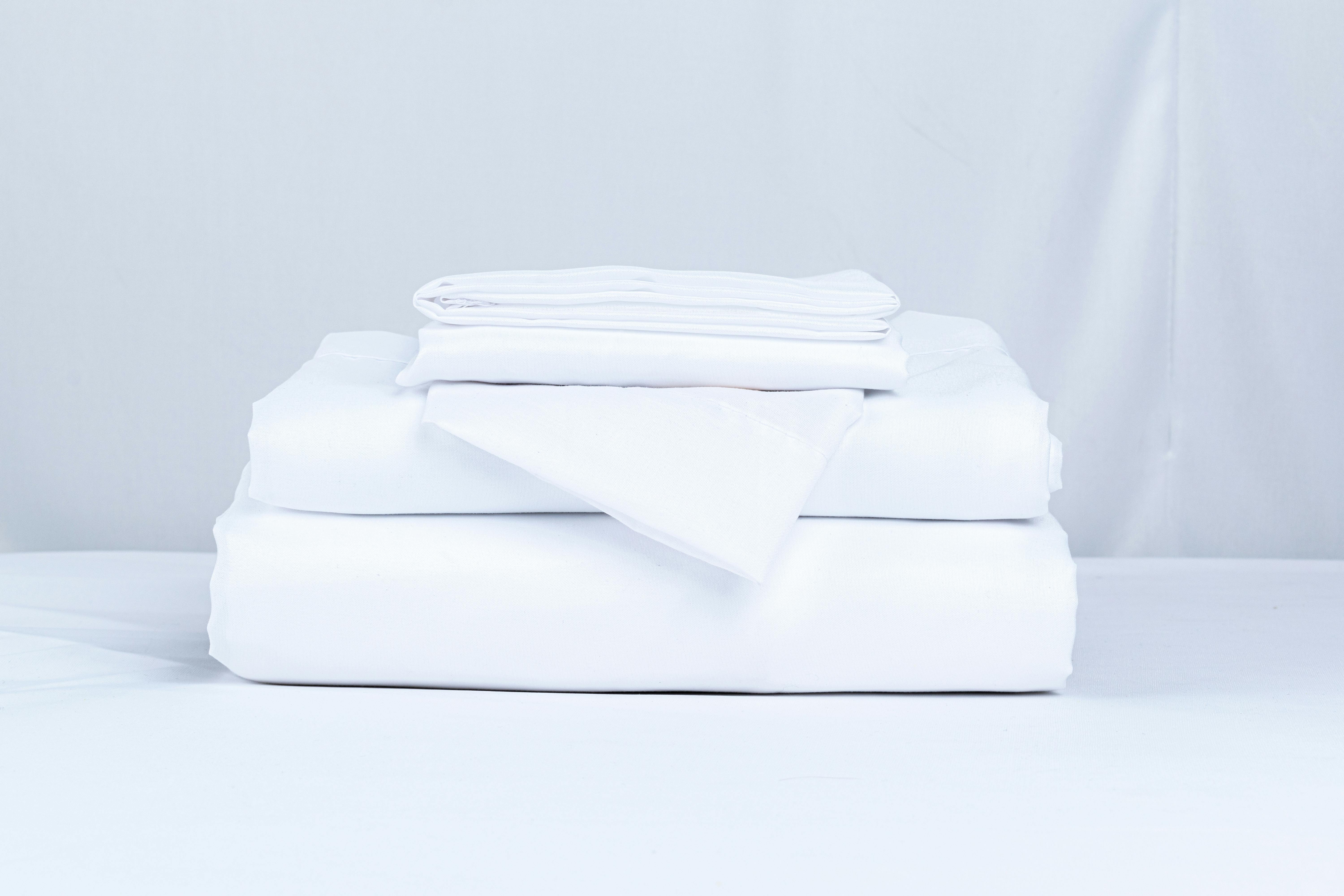 Neatly folded bed linens | Source: Pexels