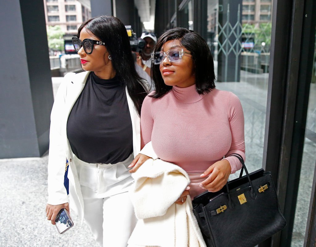 Azriel Clary and Joycelyn Savage, leave after the singer's arraignment at the Dirksen Federal Building on July 16, 2019. | Photo: GettyImages