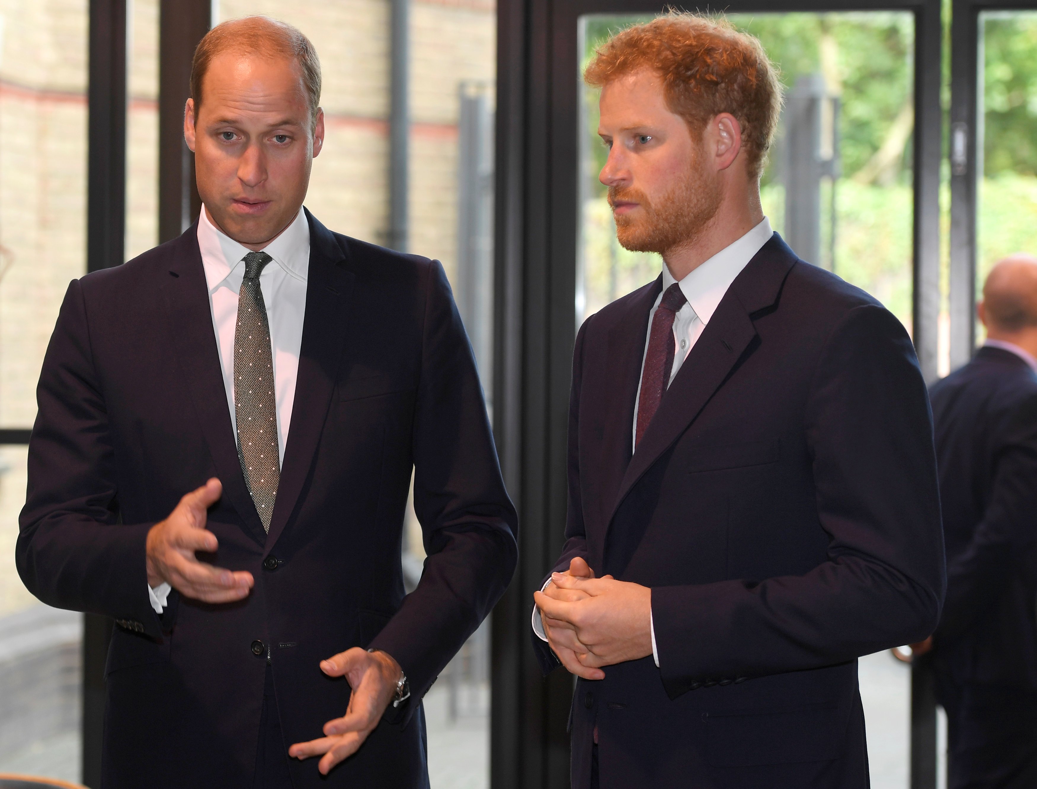 Prince William, Duke of Cambridge and Prince Harry arrive during a visit to the Royal Foundation "Support4Grenfell" community hub on September 5, 2017. | Source: Getty Images