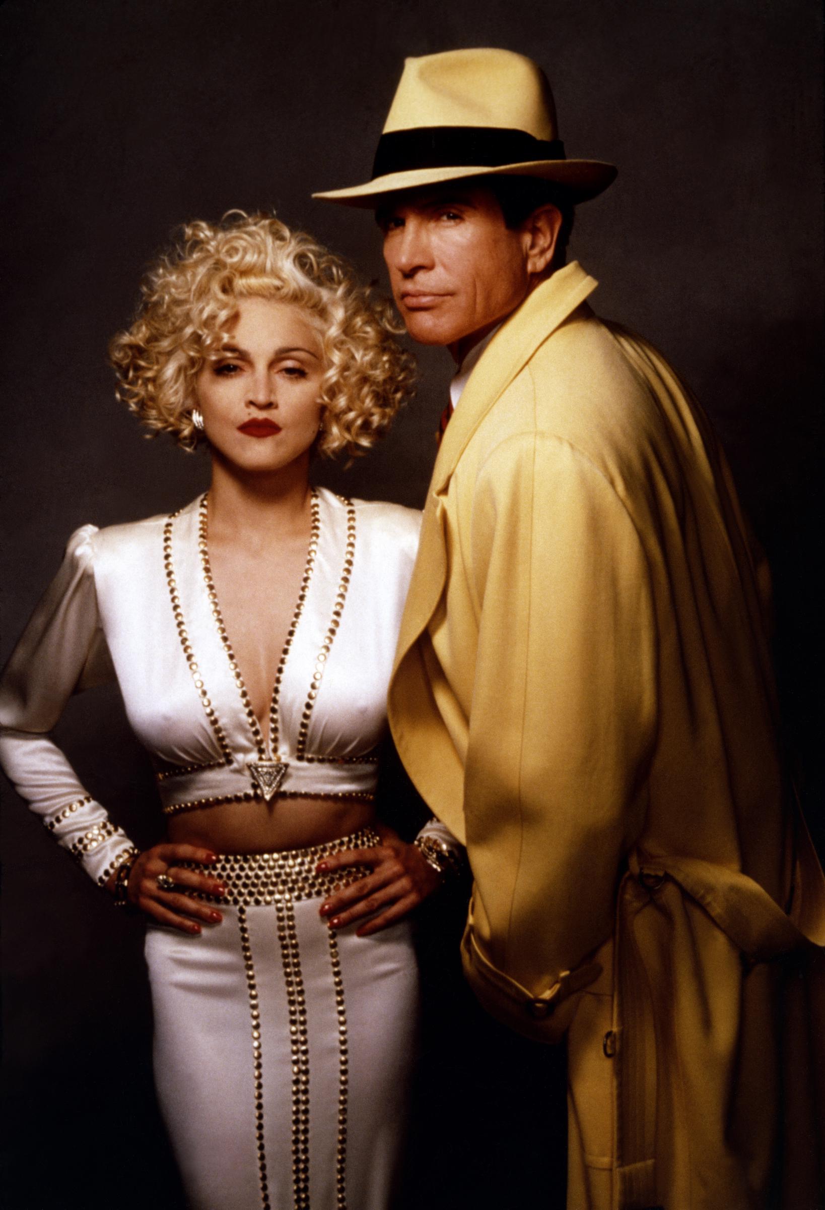 Madonna with Warren Beatty on the set of his movie 'Dick Tracy,' in 1990. | Source: Getty Images