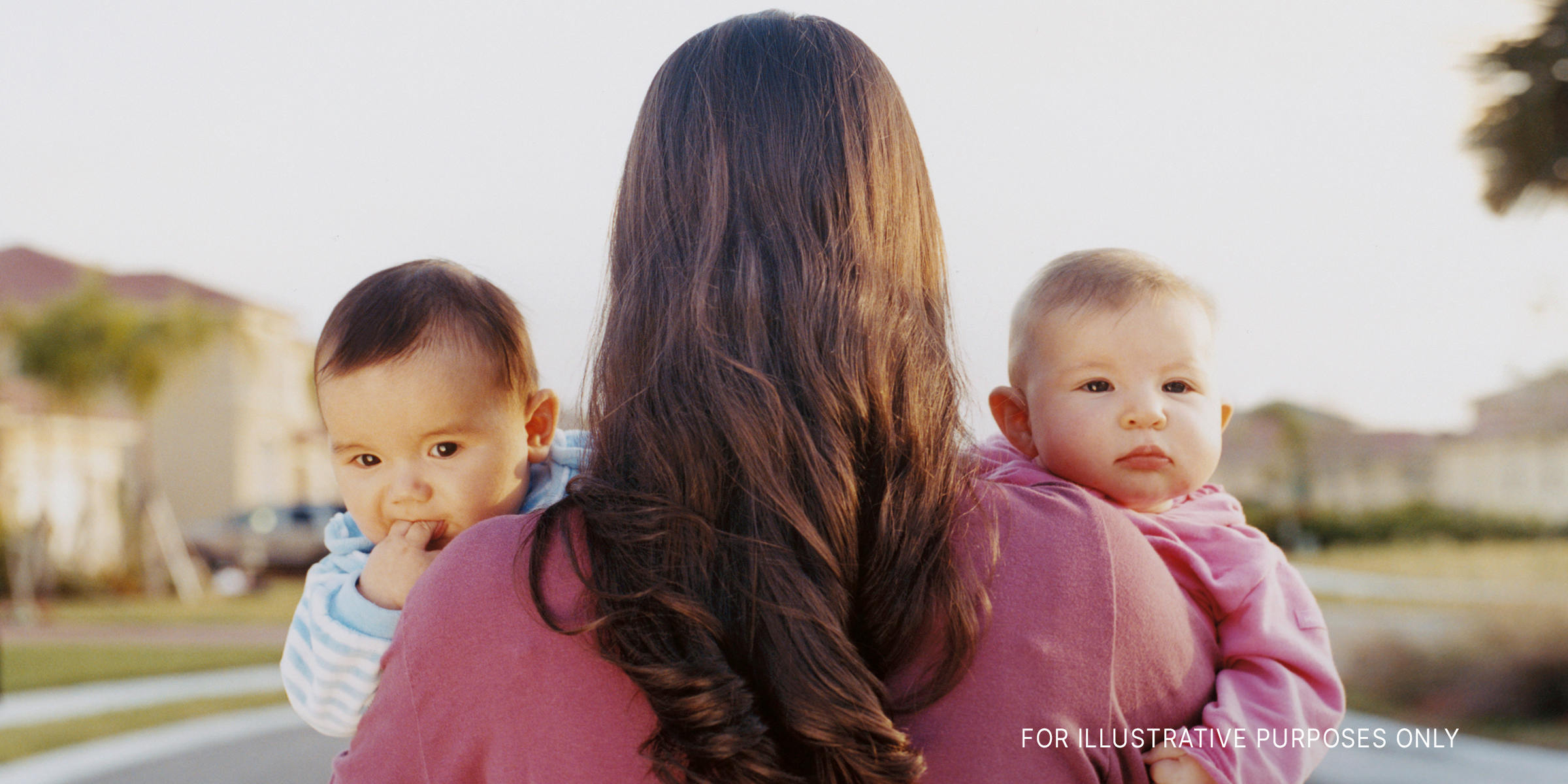A woman carrying a set of twins | Source: Getty Images