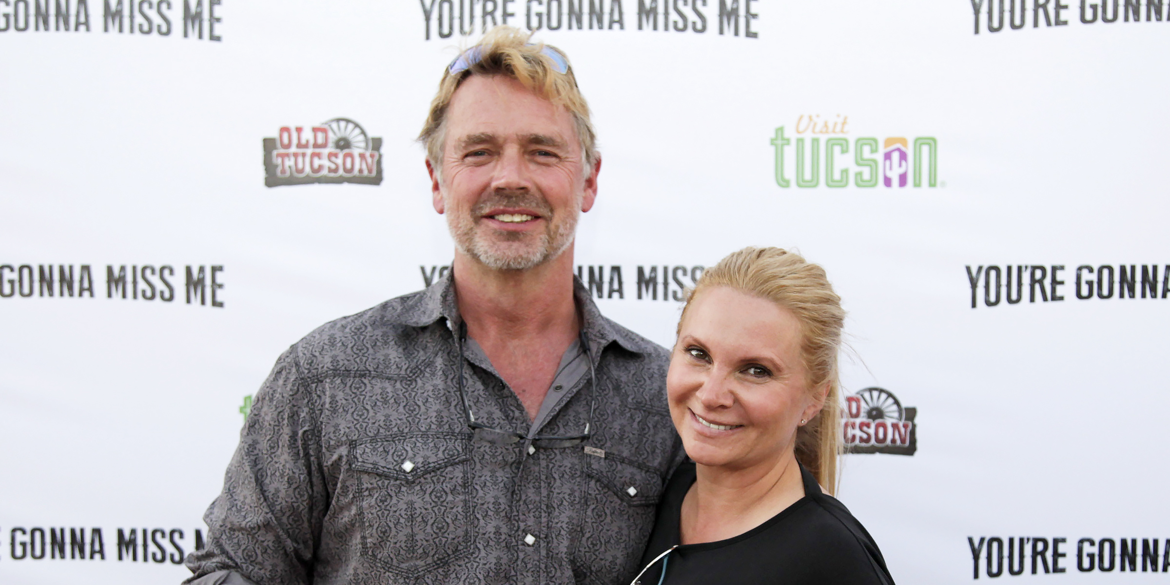 John Schneider and Alicia Allain | Source: Getty Images