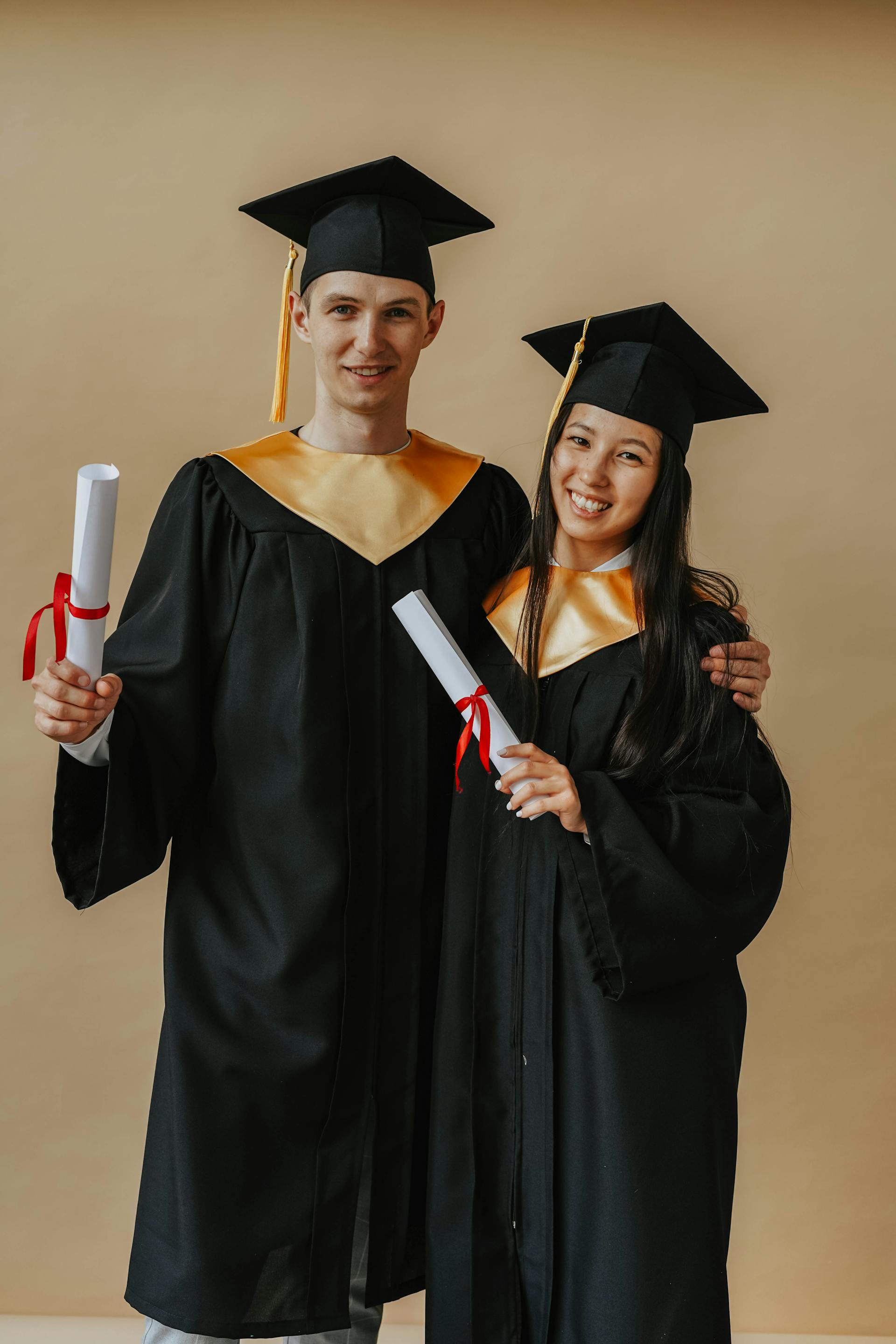 A couple in graduation gowns | Source: Pexels