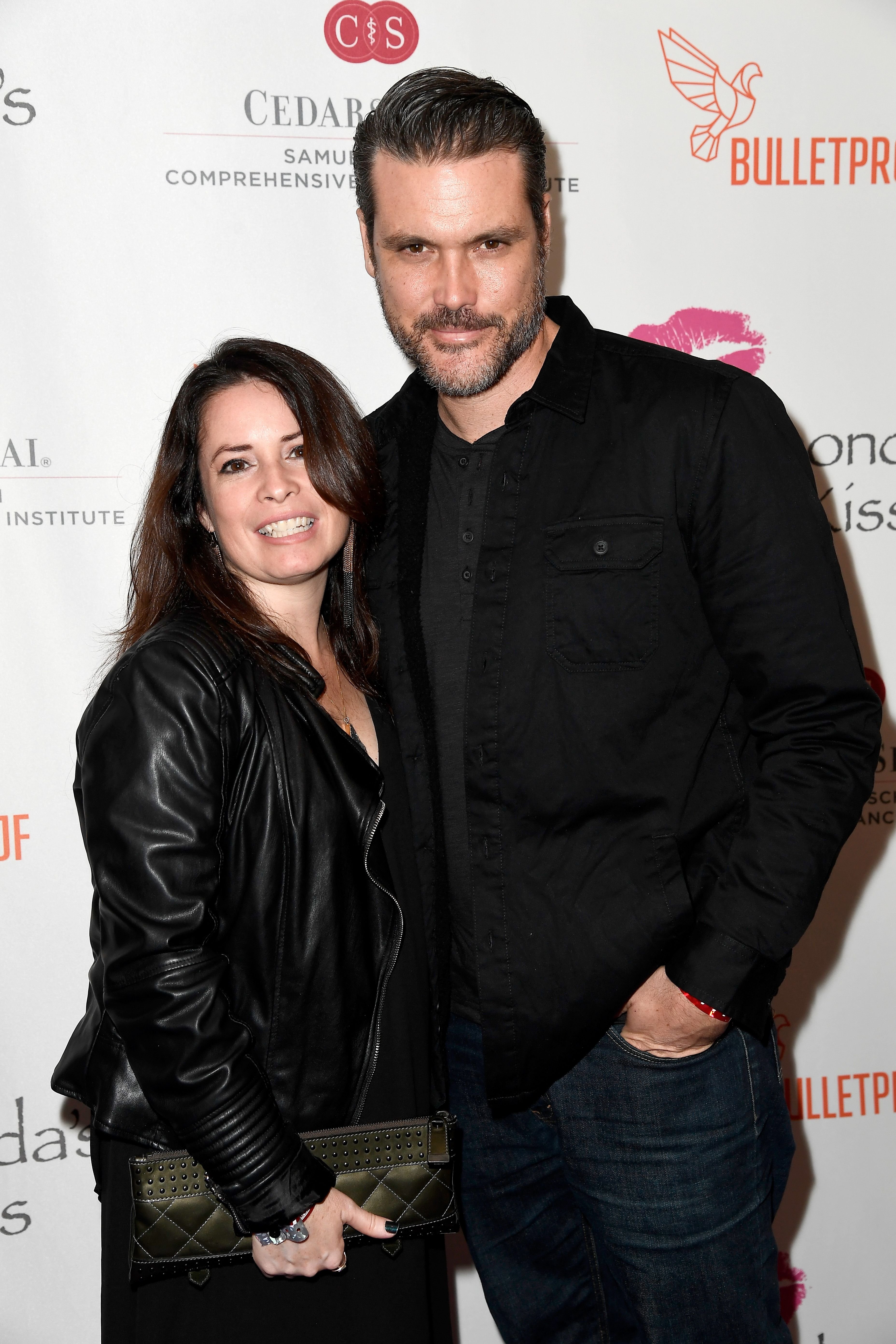 Holly Marie Combs and Mike Ryan at the 2016 Rhonda's Kiss Benefit in Los Angeles, California | Source: Getty Images