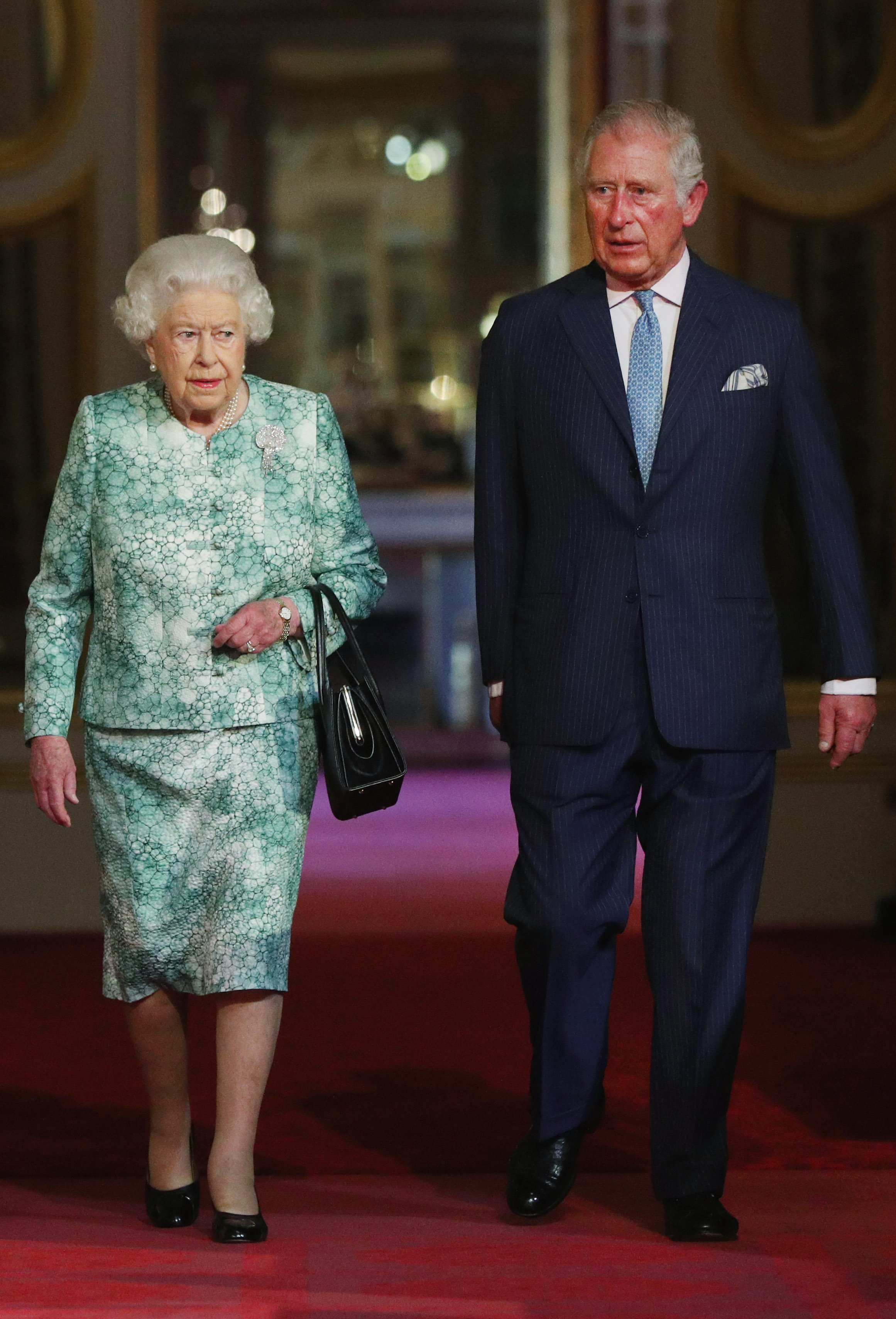 Queen Elizabeth II and Prince Charles, Prince of Wales attend the formal opening of the Commonwealth Heads of Government Meeting on April 19, 2018, in London, England. | Source: Getty Images.
