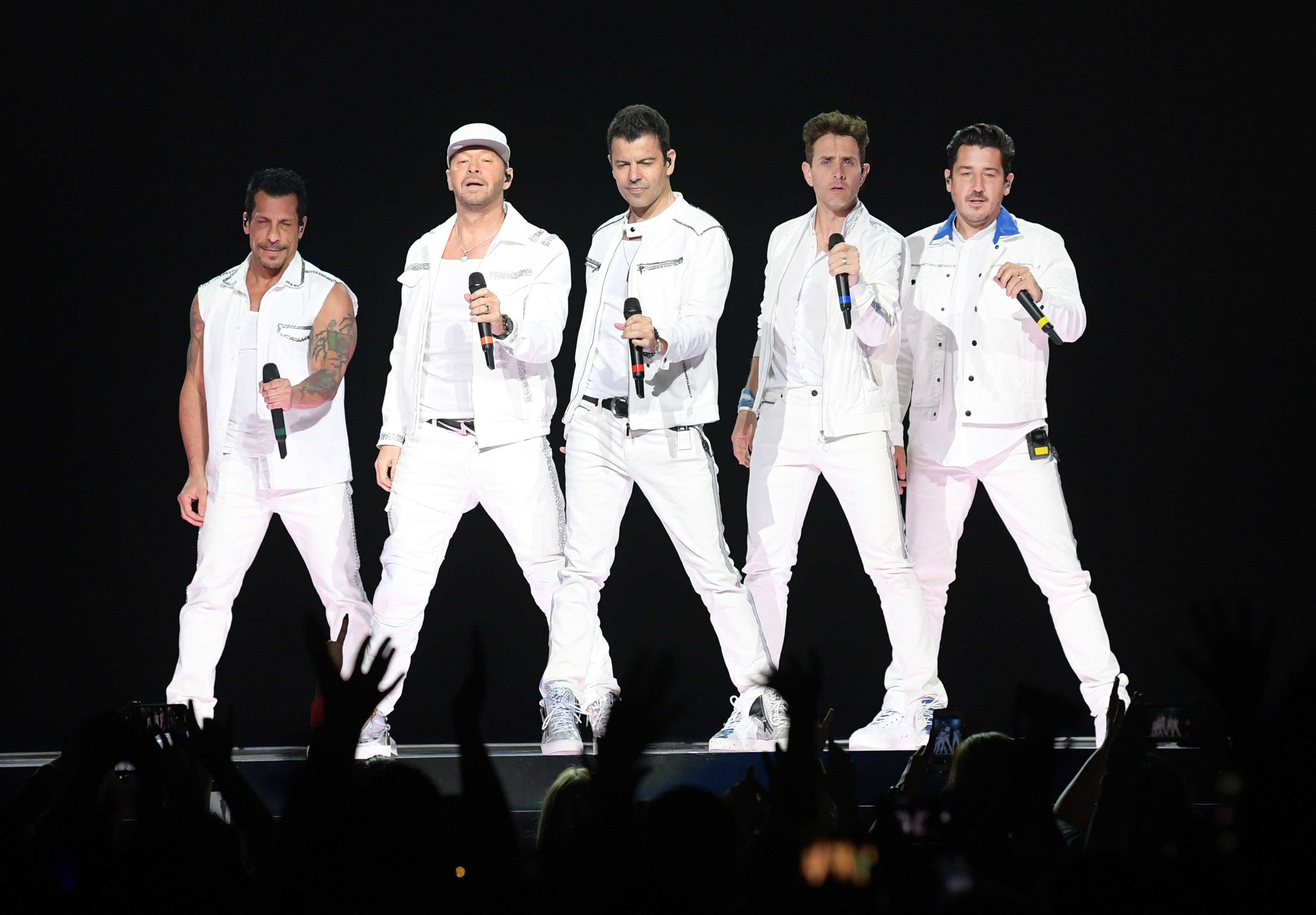 Danny Wood, Donnie Wahlberg, Jordan Knight, Joey McIntyre and Jonathan Knight of the musical group New Kids On The Block perform at Bridgestone Arena on May 09, 2019, in Nashville, Tennessee. | Source: Getty Images.