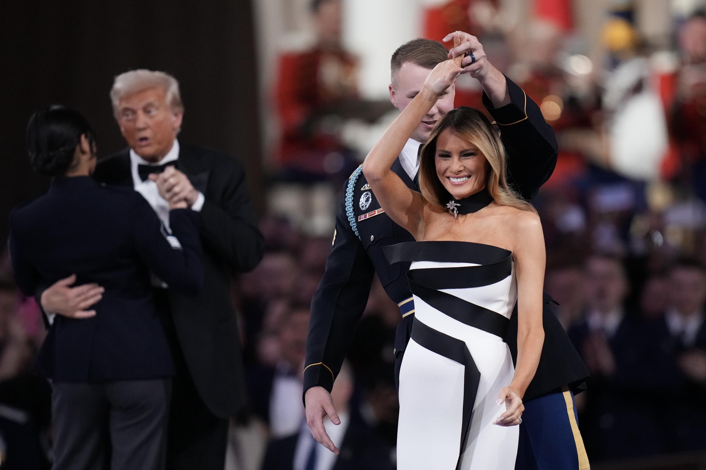 Melania Trump and President Donald Trump dance with service members at the Commander-in-Chief Ball on January 20, 2025 | Source: Getty Images